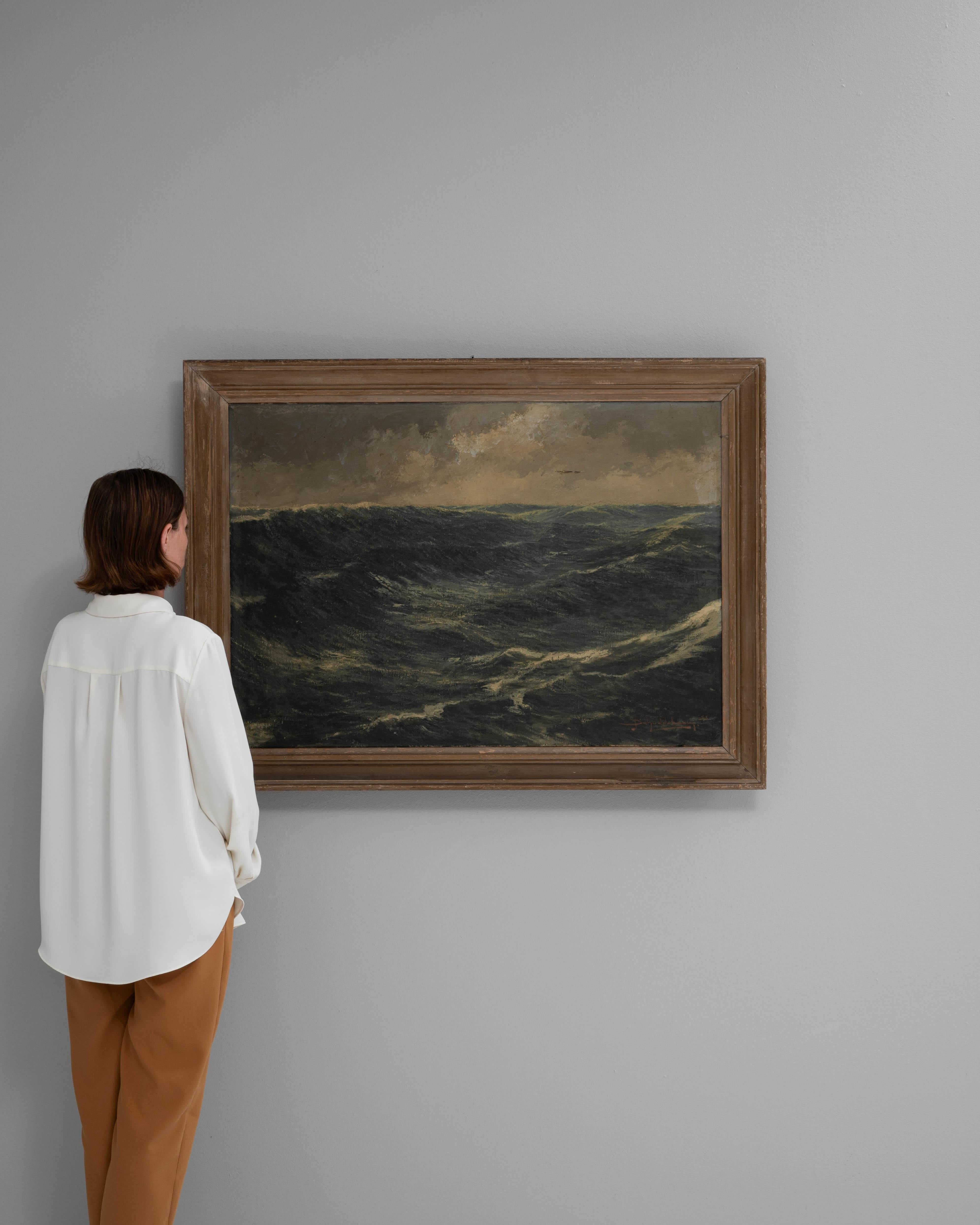 This evocative 20th-century Belgian painting captures the raw beauty and movement of the open sea, with dramatic waves under a moody sky. The artist's skillful brushstrokes convey a sense of depth and turbulence, immersing the viewer in the powerful