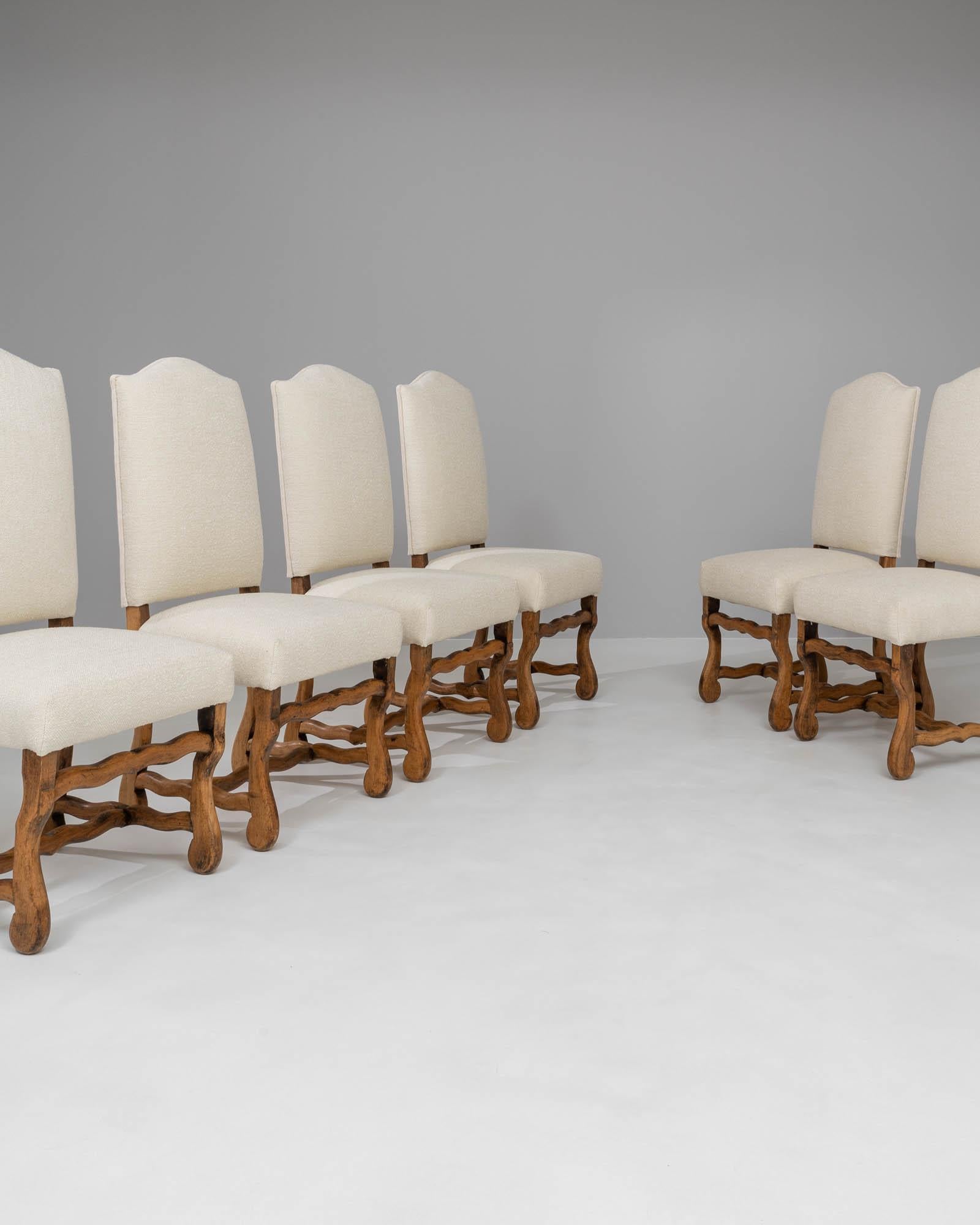 Introducing the exquisite set of six 20th Century Belgian Upholstered Dining Chairs, a testament to timeless elegance and unparalleled comfort. These chairs feature a classic design that exudes a warm, inviting atmosphere, perfect for lingering over
