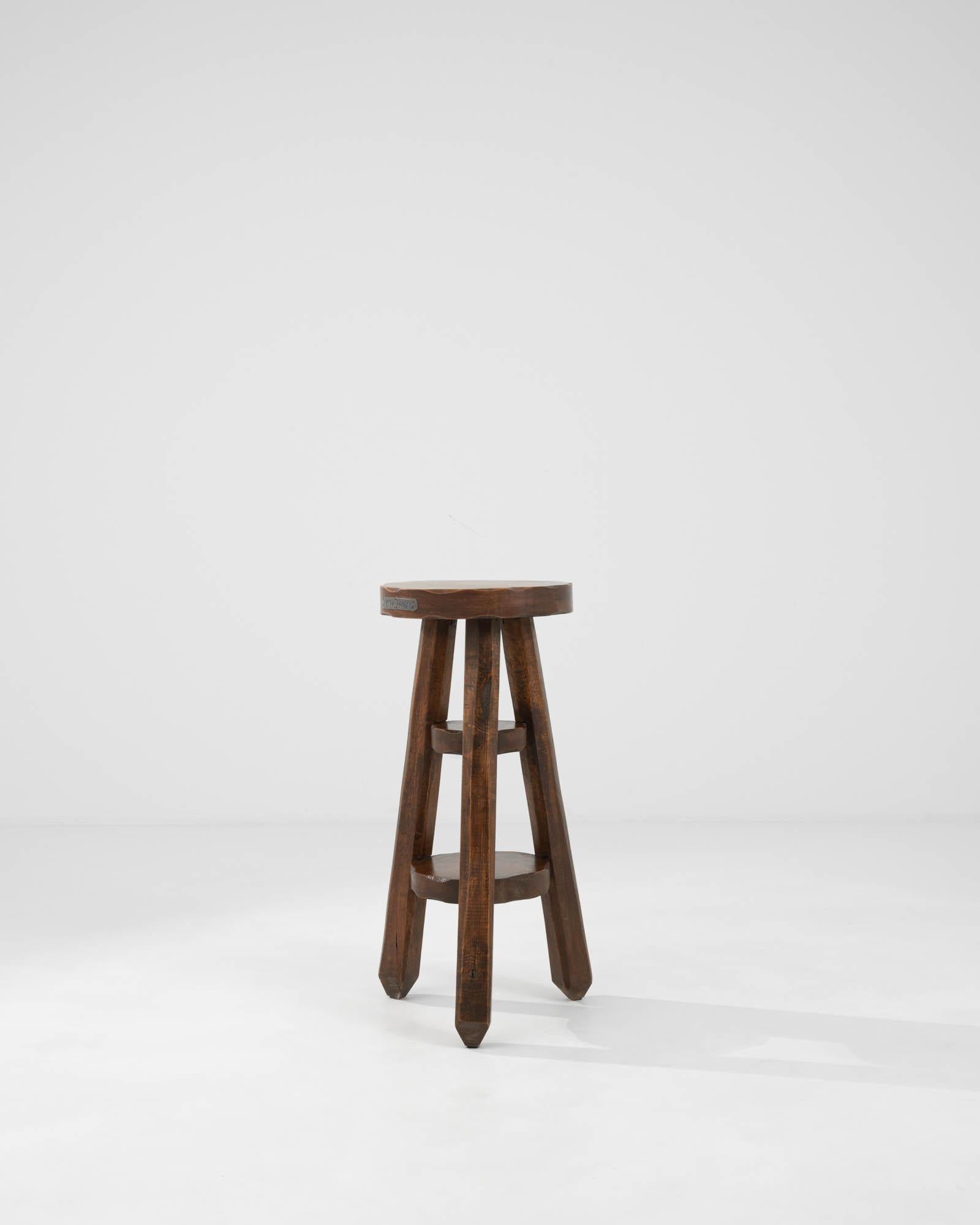 Embrace timeless elegance and sturdy craftsmanship with this 20th Century Belgian Wooden Pedestal, an authentic piece of history that brings a touch of classic charm to any space. Perfect for collectors and enthusiasts of antique furniture, this