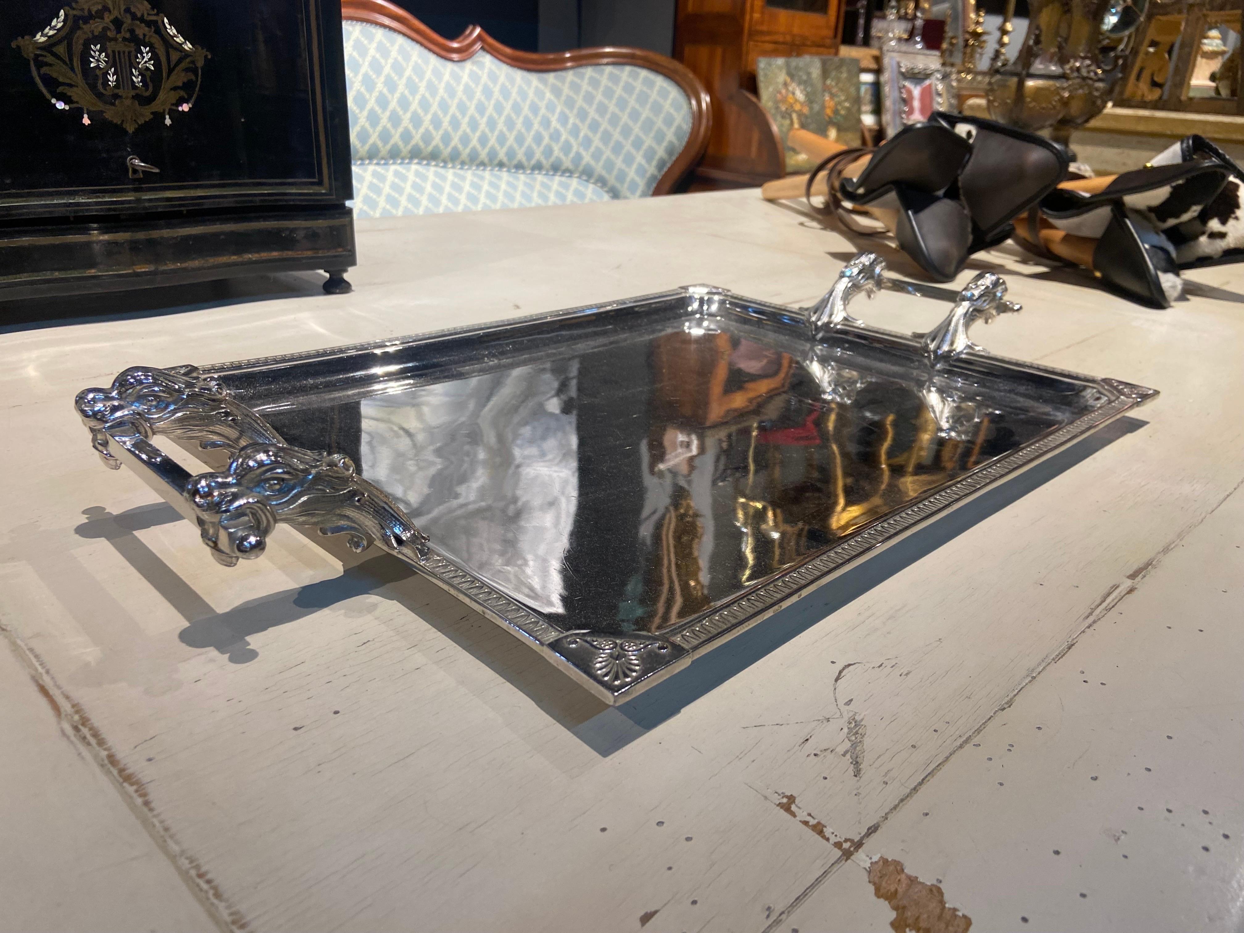 Large hand made silver plate serving tray stamped Wiskemann in original condition. There are two animal's heads supporting the handles on each side. We may offer deferent types of small silver plated tea and coffee pots from the same