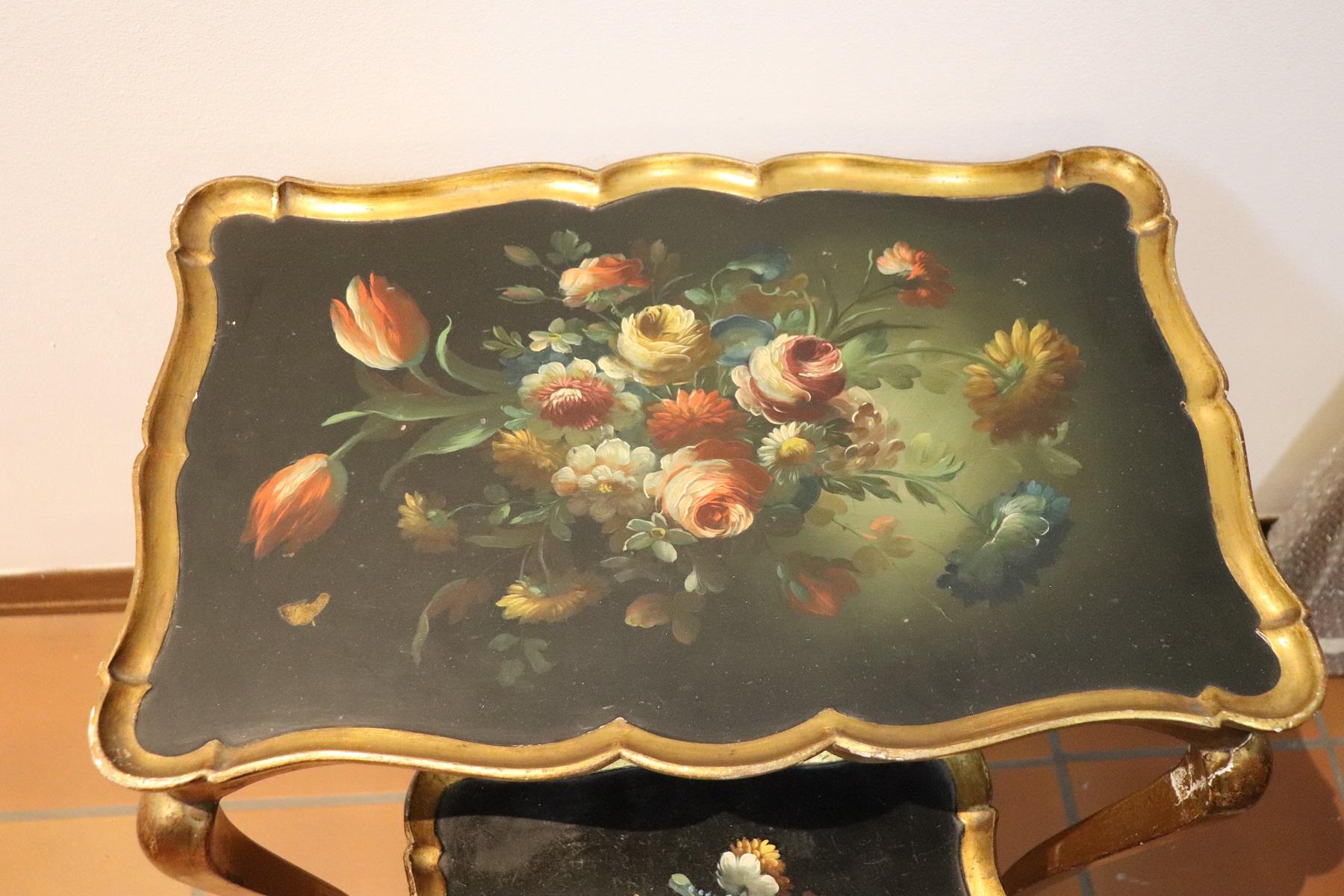 Rare and fine quality Italian Louis XV style, 1930s two side tables or sofa tables. The tables has a particular legs slender. Fine hand painted decoration with floral taste. Painting of great pictorial quality. The legs are golden with gold leaf.