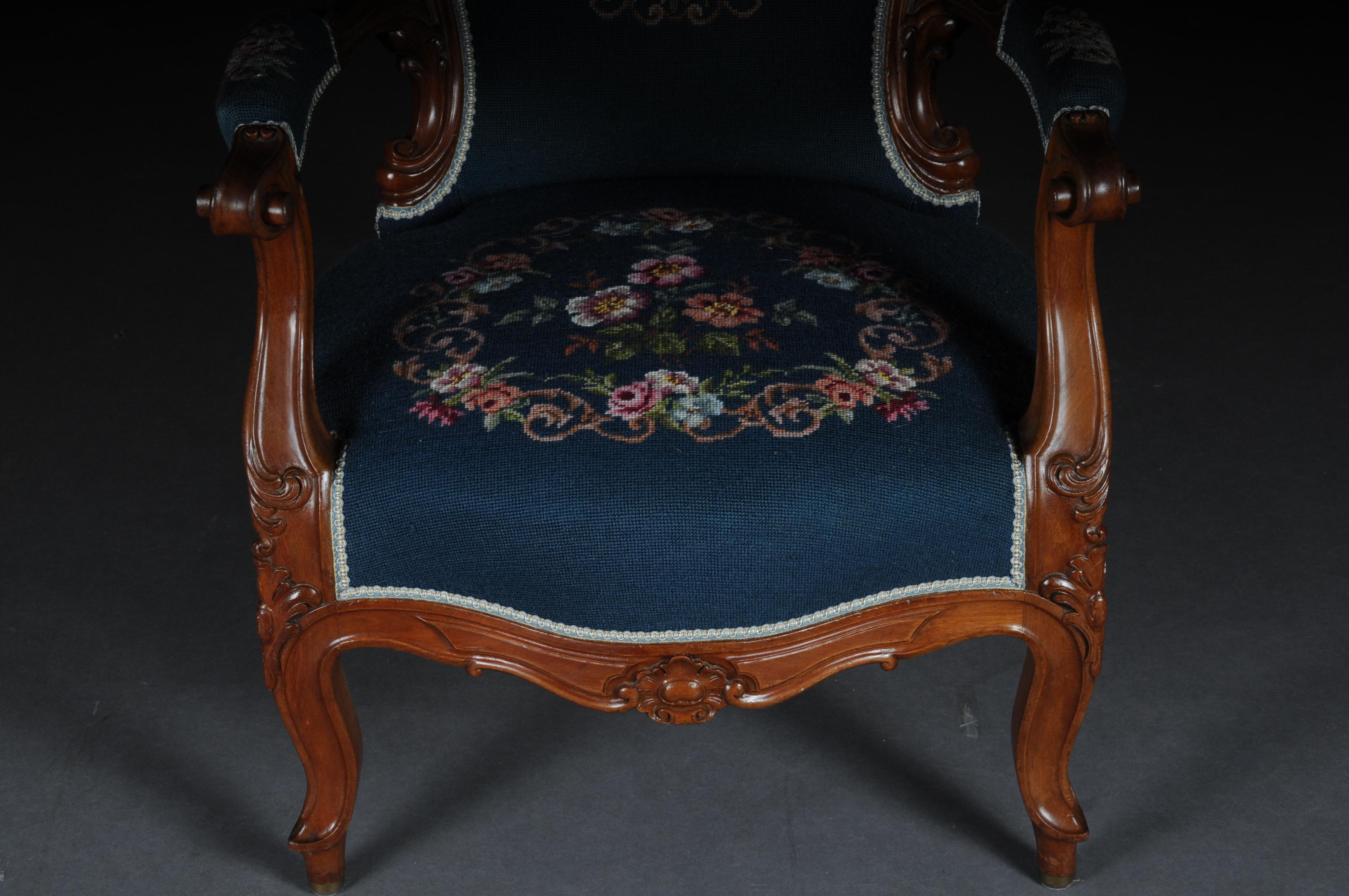 Solid mahogany body.
Richly carved and curly. Classic upholstery upholstered in a blue, embroidered fabric.

(B-147).
 
