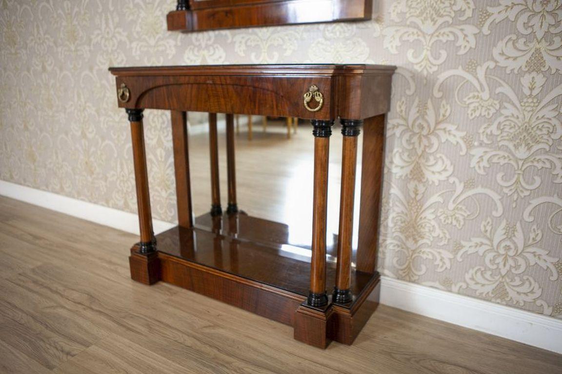 20th-Century Biedermeier Set of Console Table and Mirror

We present you this console table & wall mirror, set the in Biedermeier style. It was made in the 1960s. The console features a spacious drawer, adorned with subtle metal fittings, and the 