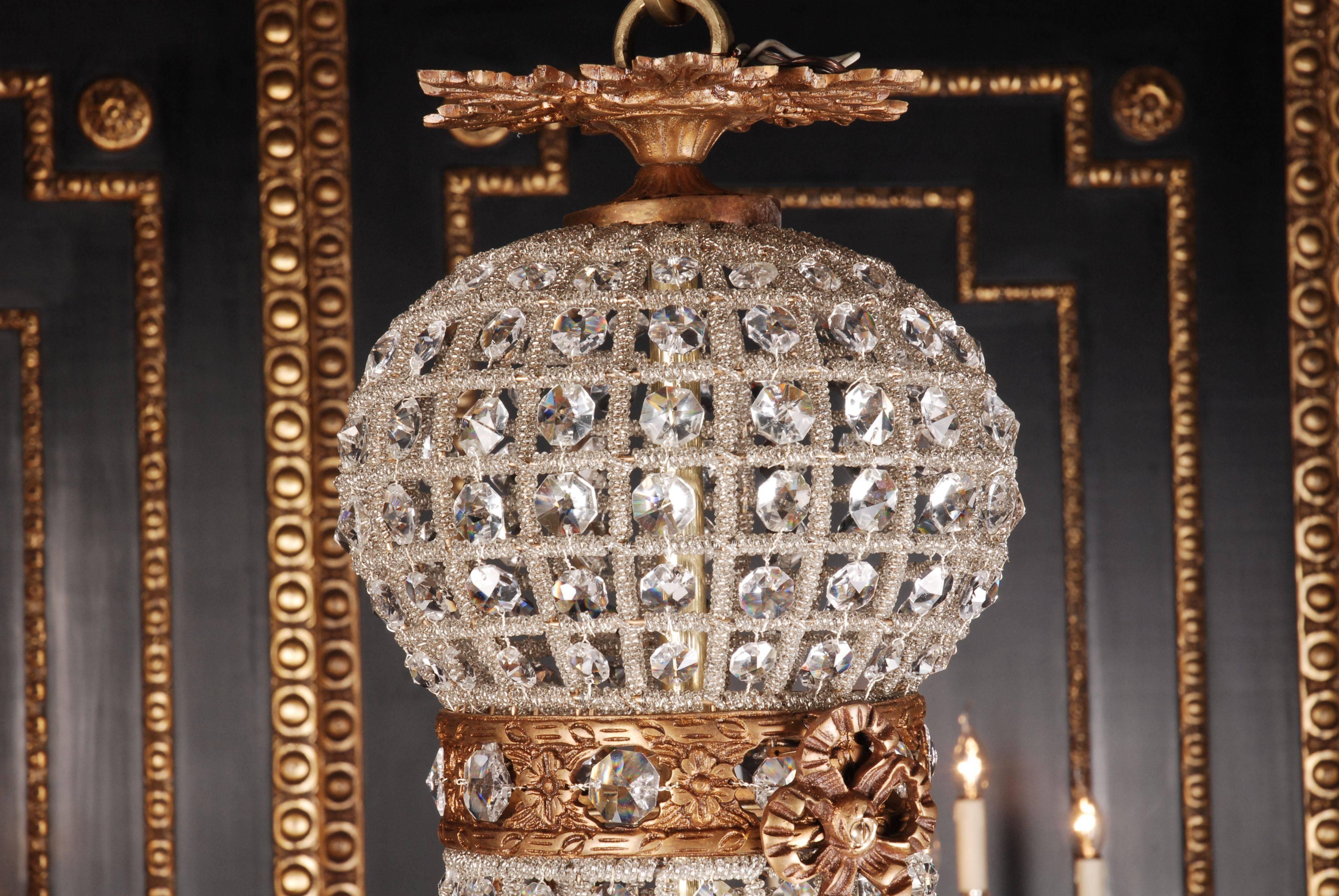 Classical basket candelabra in Biedermeier style.
Finely engraved bronze. Net grid with hand ground crystal stones.

(F-Me-2).