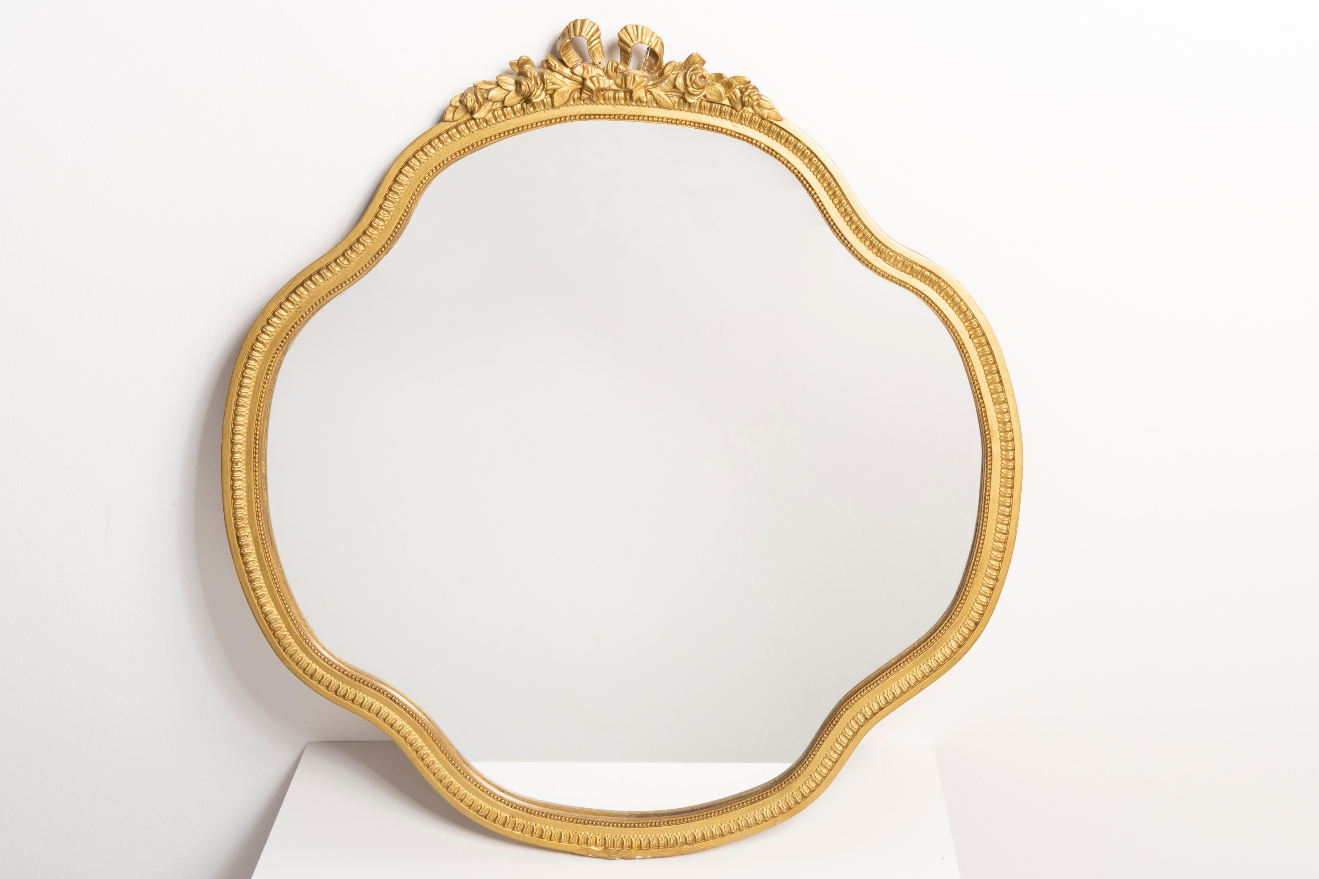 A beautiful romb mirror in a golden decorative frame with flowers from Italy. The frame is made of wood. Mirror is in very good vintage condition. Original glass. Beautiful piece for every interior! Only one unique piece.
