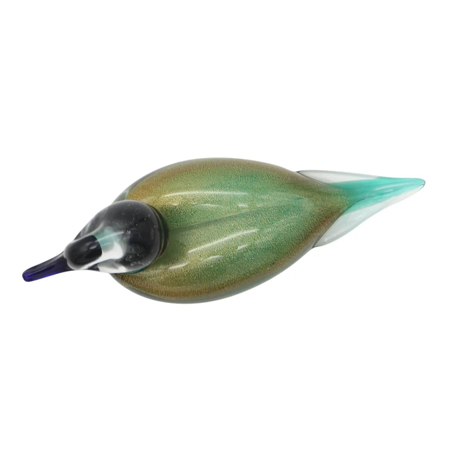A bilious green, vintage Mid-Century Modern Italian duck made of hand blown colored Murano glass, designed, produced by Paolo Venini and Toni Zuccheri in good condition. The beak and neck of the table, room décor piece is made of black glass,
