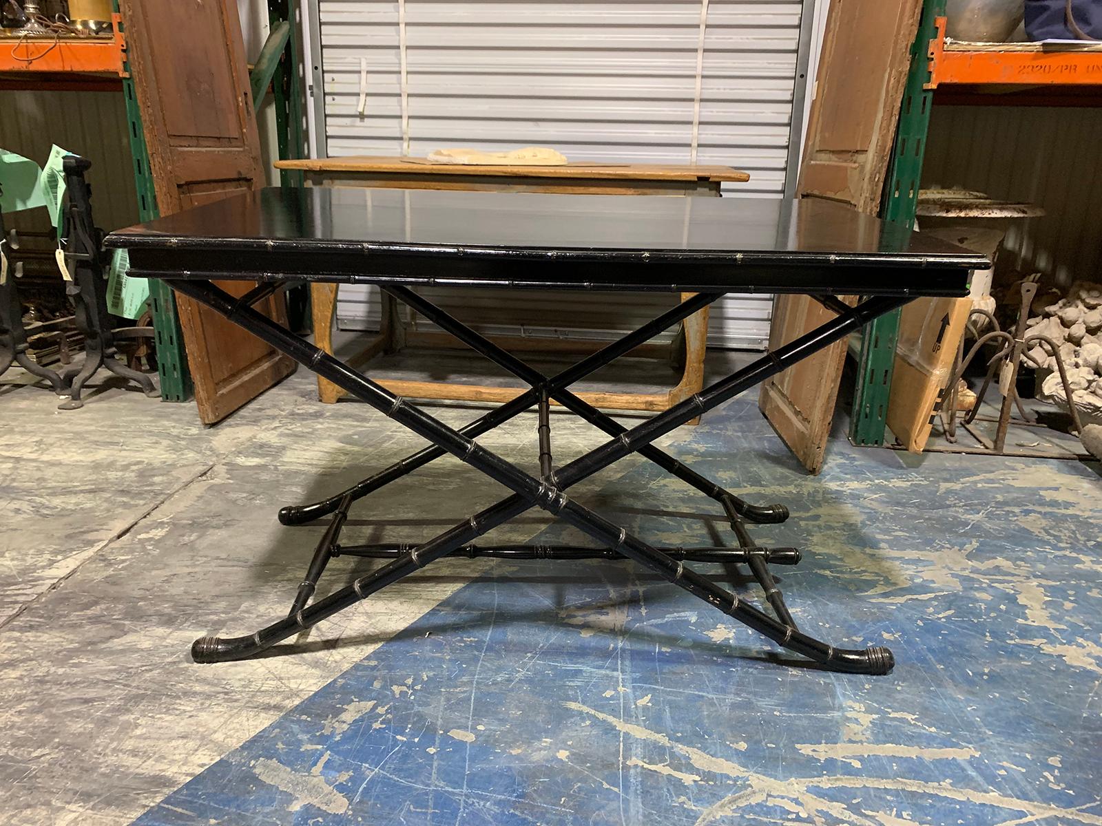 20th century black coaching table with faux bamboo base.