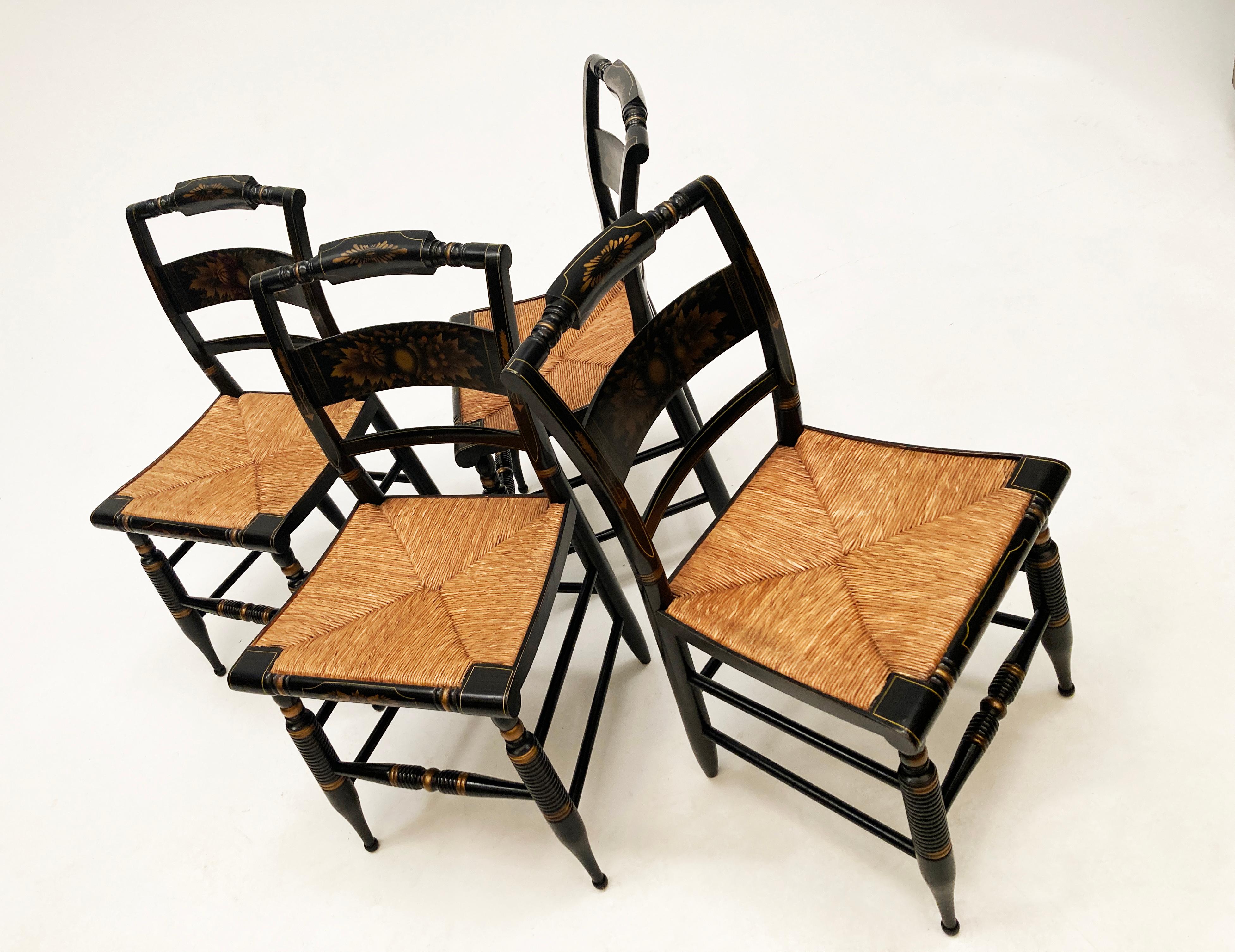 Mid 20th Century Black harvest  dining chairs, set of 4 by L. Hitchcock, Hitchcock Chair Company out of Connecticut. Just as one would expect with Hitchcock chairs, these are beautiful! With the beautiful gold harvest stenciling over the black