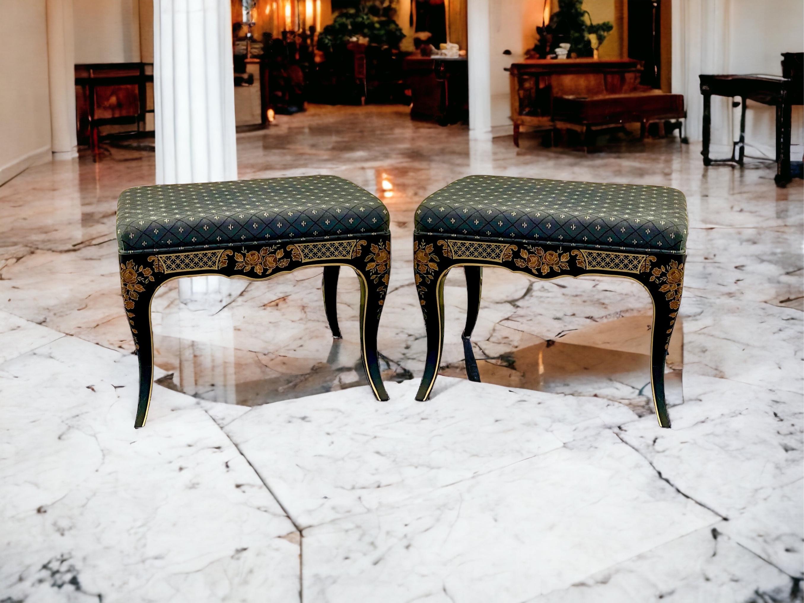 This is a classic pair of black lacquer painted chinoiserie ottomans dating approximately to the 1980s. The upholstery is vintage and shows light wear. They are American. add 