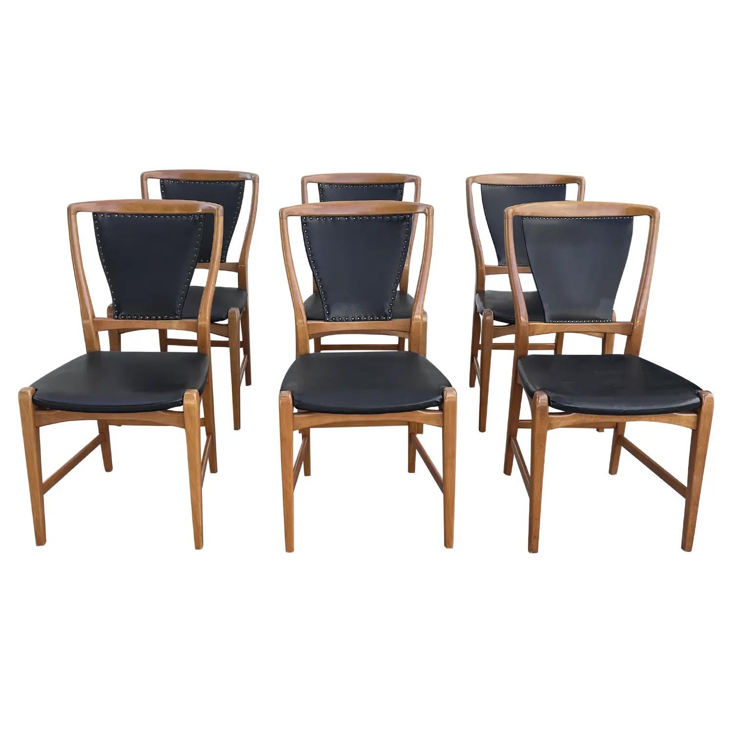 A black, vintage Mid-Century modern Swedish set of six dining chairs made of hand crafted Pearwood, designed and produced by an unknown architect from Stockholm, in good condition. The seat, back rest of the Scandinavian side chairs are upholstered