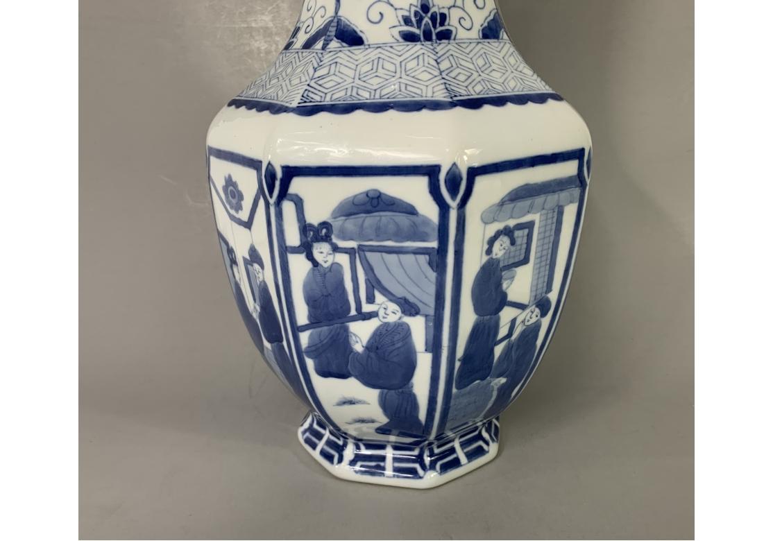 Blue and white Chinese porcelain footed vase with 8 figural panels. The neck decorated with geometric motifs, Chinese meandering design, abstractions and scrolls.

Dimensions: 7 1/2