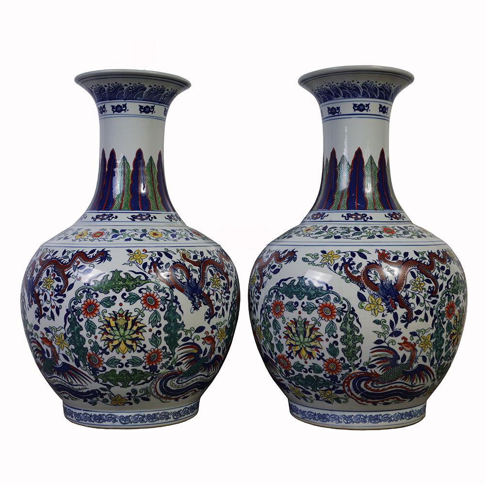 Look at this magnificent Chinese antique Famille Rose porcelain vases. It was hand made and hand paint from famous Chinese Porcelain. Early 20 C. piece. It has very fine hand painted Chinese traditional folks arts of dragon and phoenix and floral