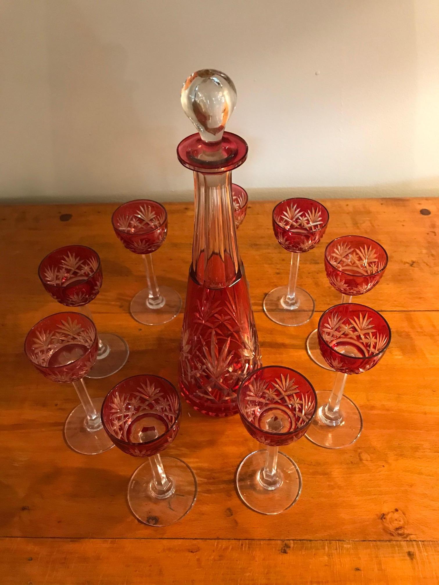 Beautiful 20th century Bohemia crystal set of nine liquor glasses and a decanter from the 1930s.
Nice red color and elegant pattern and shape.
The plug is removable.
Nice quality.