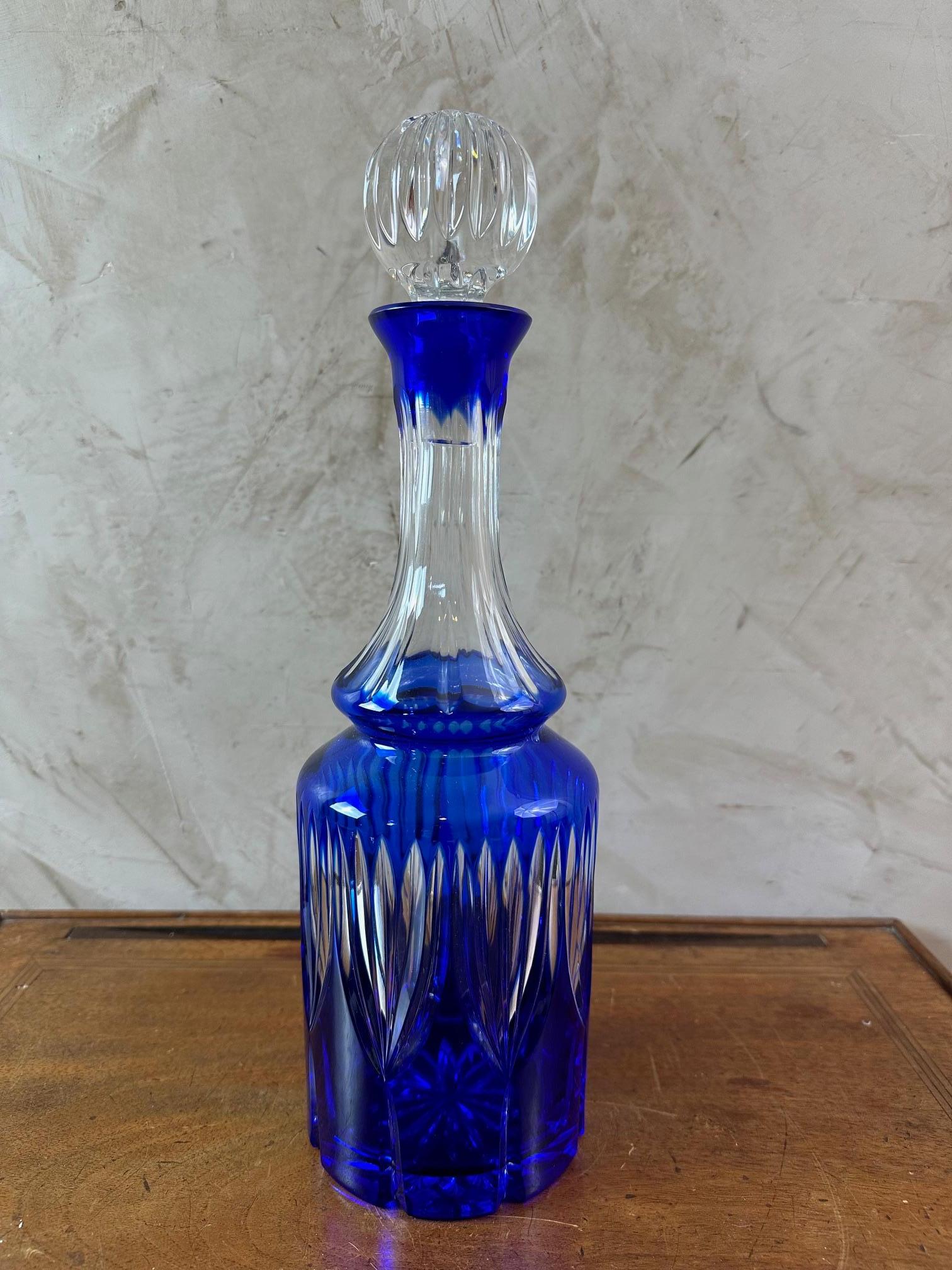Beautiful blue bohemian crystal whisky decanter from the 50s.
Rounded shape.
Made in Poland. Perfect condition. Superb work of hand-cut crystal.
For lovers of quality pieces. Two other models available.