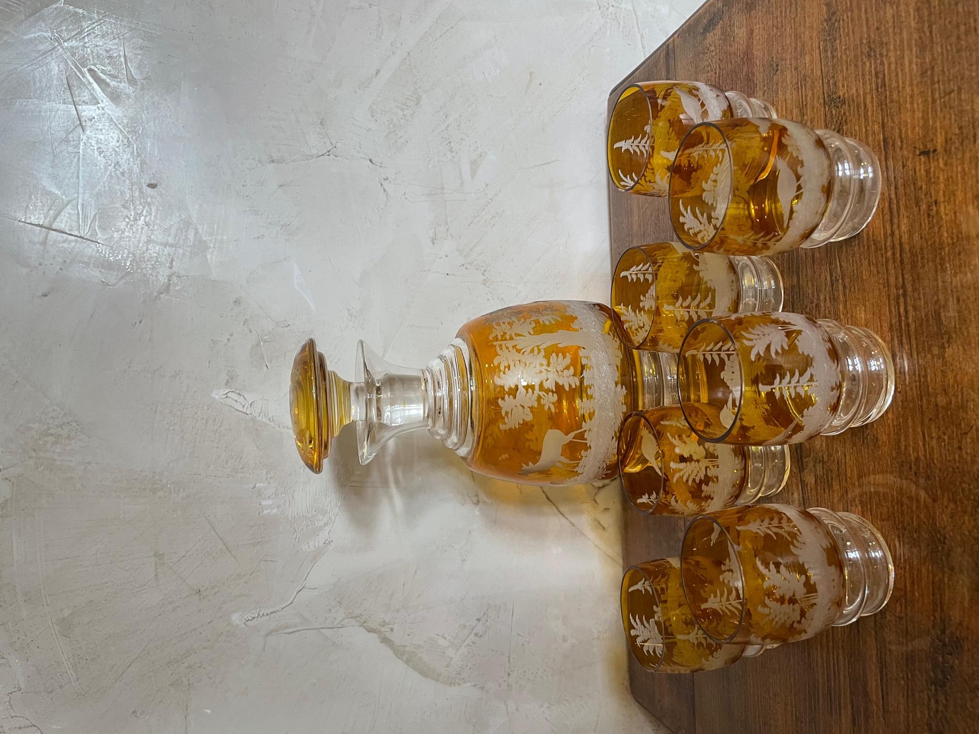 Magnificent liquor service in Bohemian crystal, orange color with landscape decor with engraved deer.
Dating from the beginning of the 20th century.
A decanter with its stopper and 7 liqueur glasses. 
Beautiful condition and very good quality.