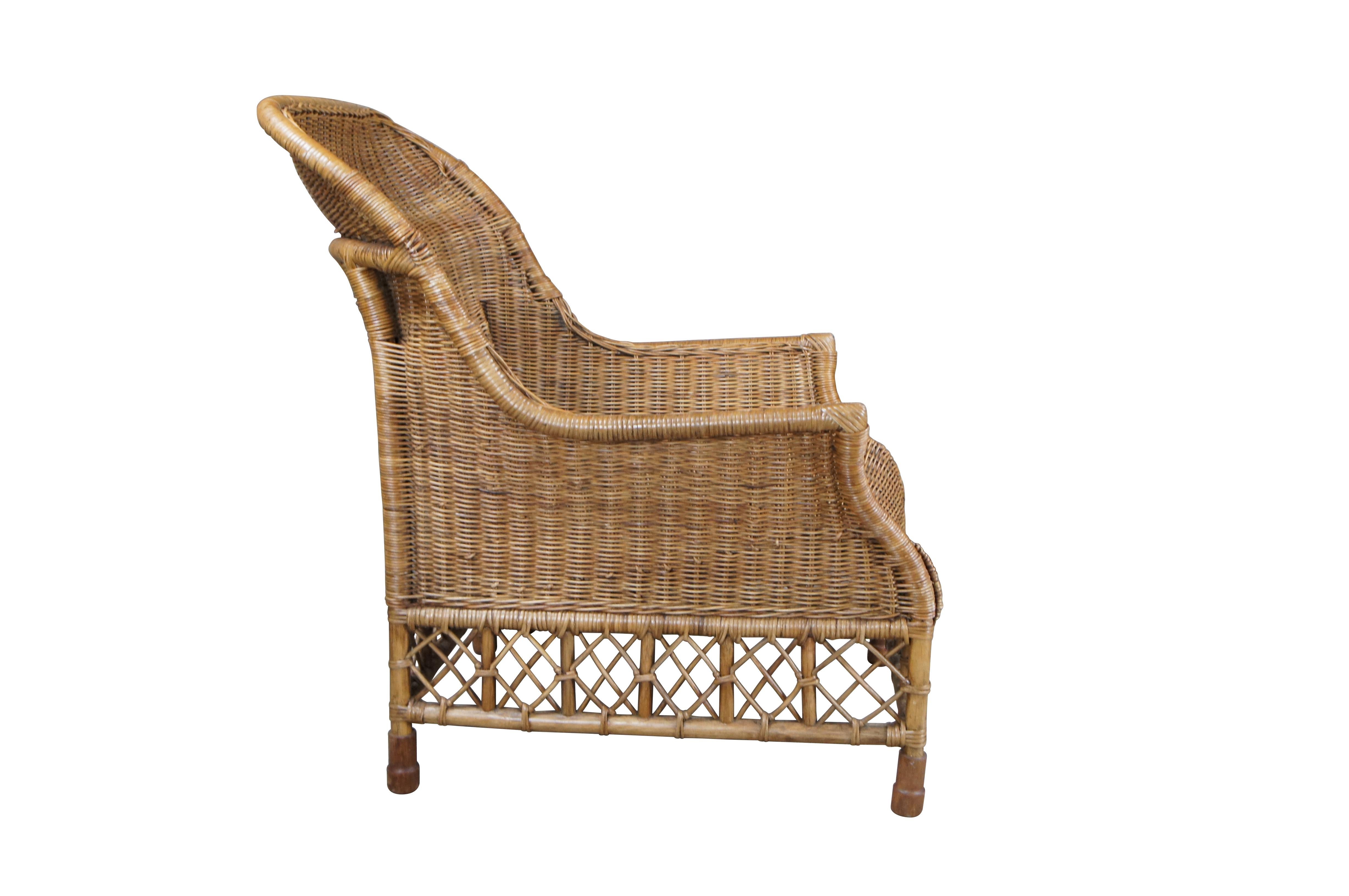 Late 20th Century bohemian modern wicker lounge chair. Features a sloped frame with deep contoured back and lattice apron along the base.

Dimensions:
30