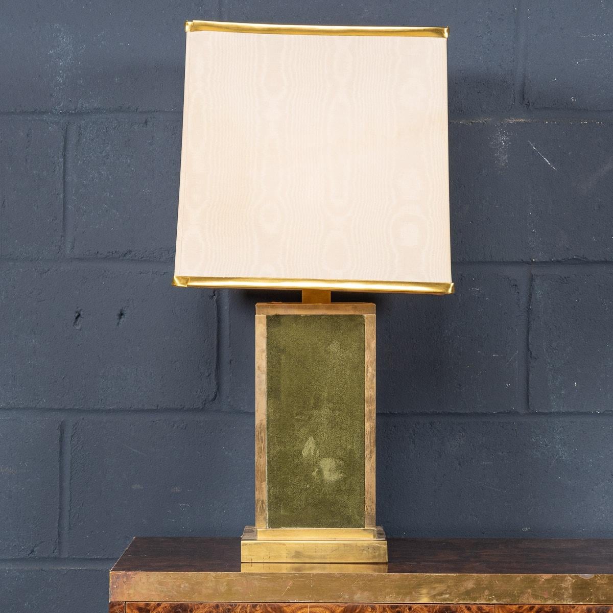 A delightful table lamp made in Italy in the 1970s. Of great proportions, this lamp is available with its original silk shade. The body of the lamp has a brass structure encasing a green suede or microfibre cladding and would look fantastic in any