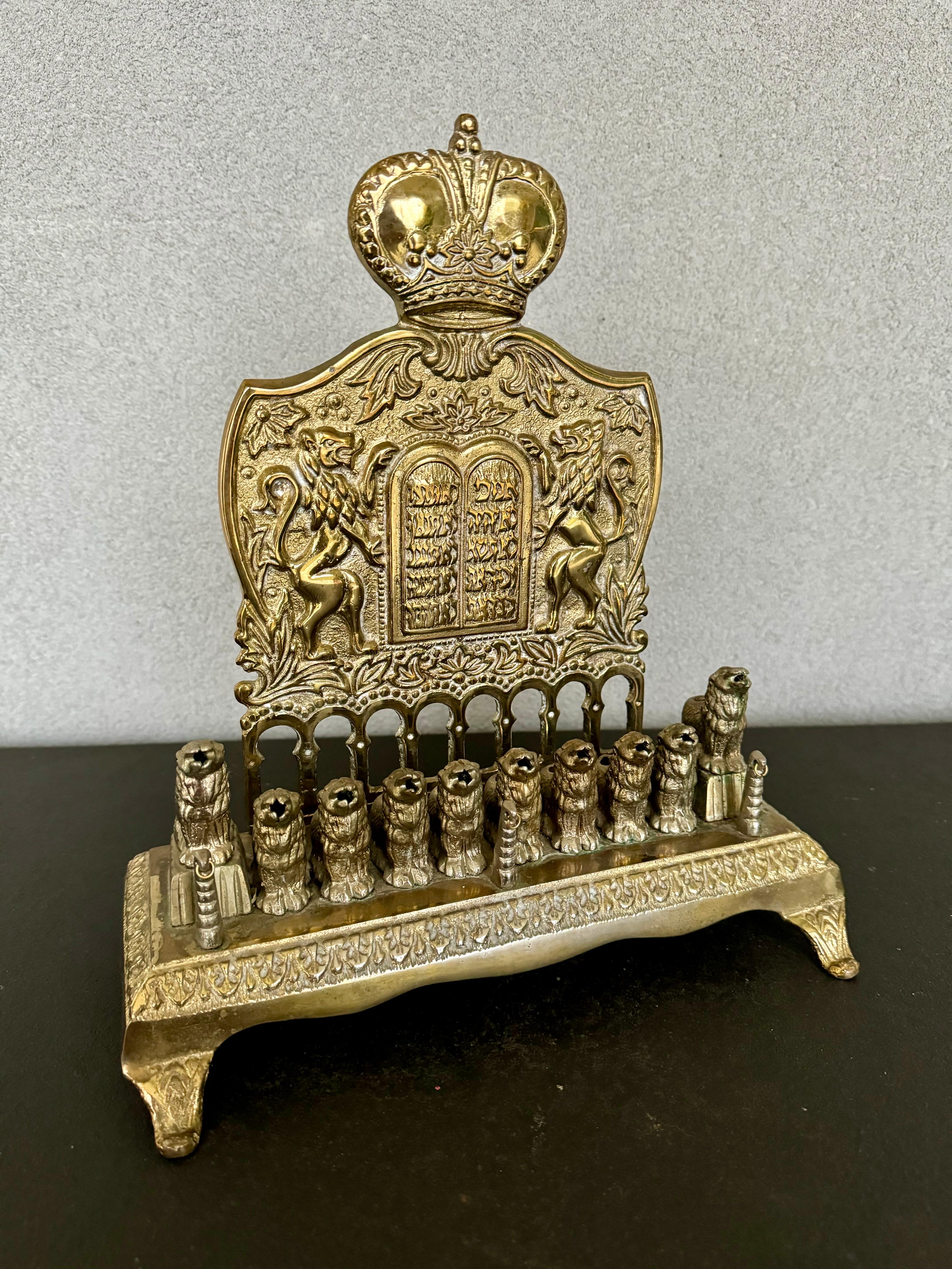 Rare and unique reproduction of an antique German Menorah, cast in brass with 10 Lion candleholders 
