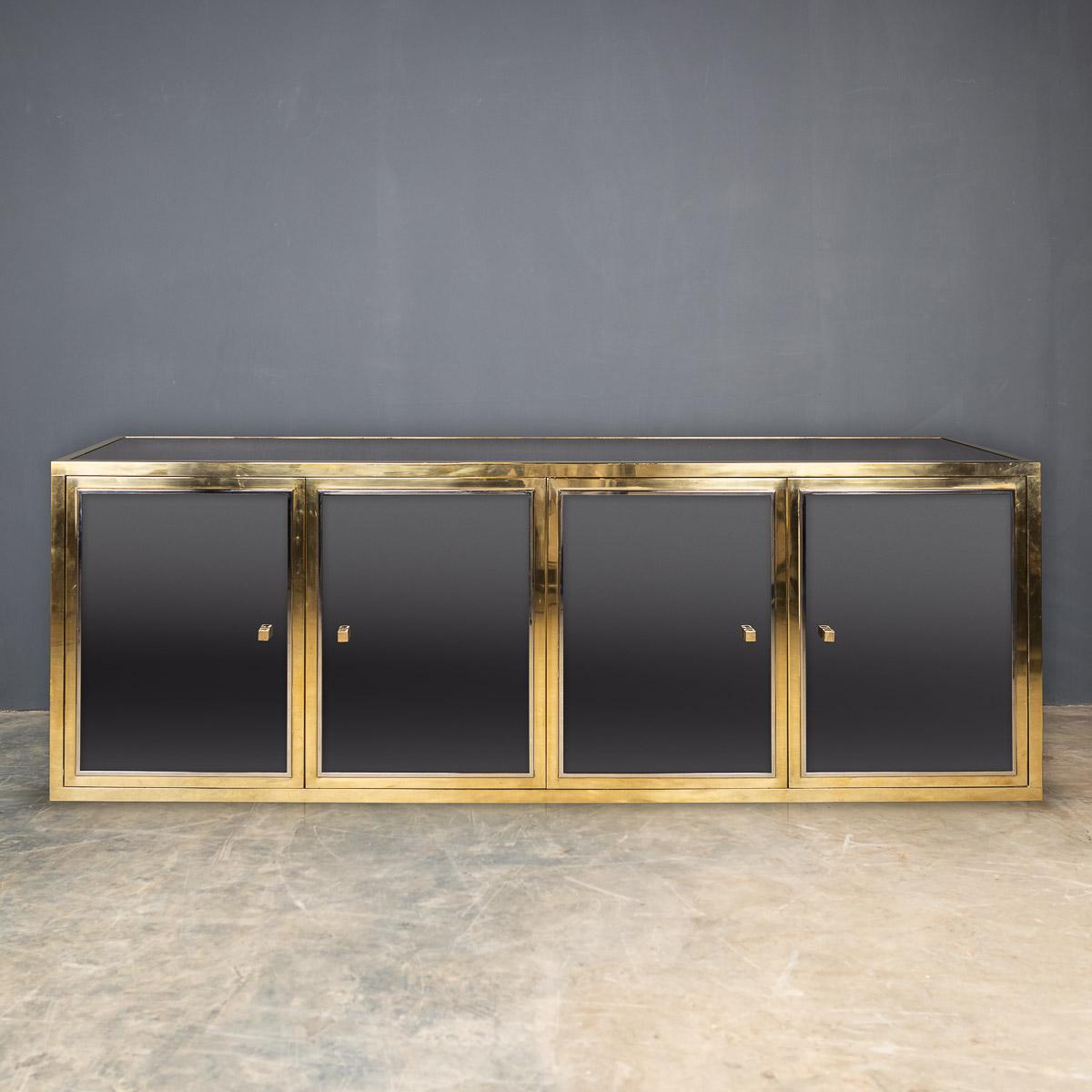 A large mirrored credenza / sideboard designed by Michel Pigneres, with four brass and chrome cupboard doors with mirrored inserts and mirrored top, the side with laminated shelves.

Condition
In great condition - wear consistent with
