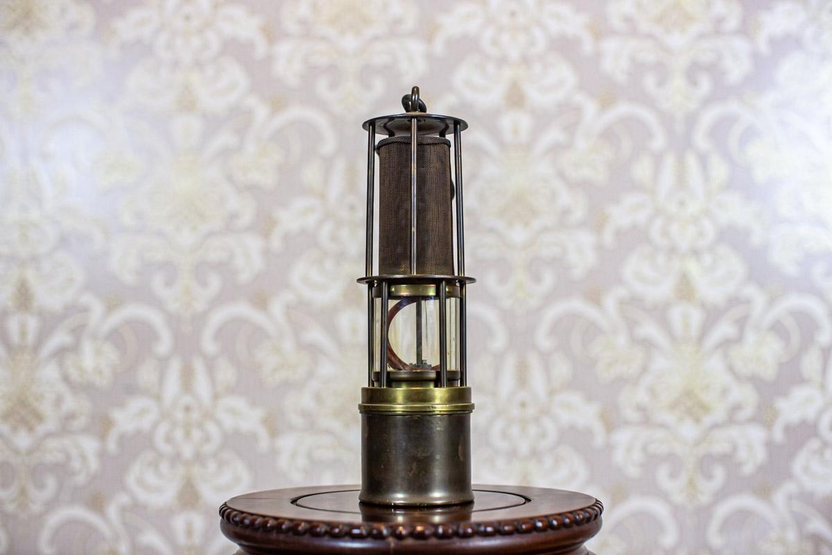 20th-Century Brass Safety Lamp

We present you this brass safety lamp that can be lit with kerosene.