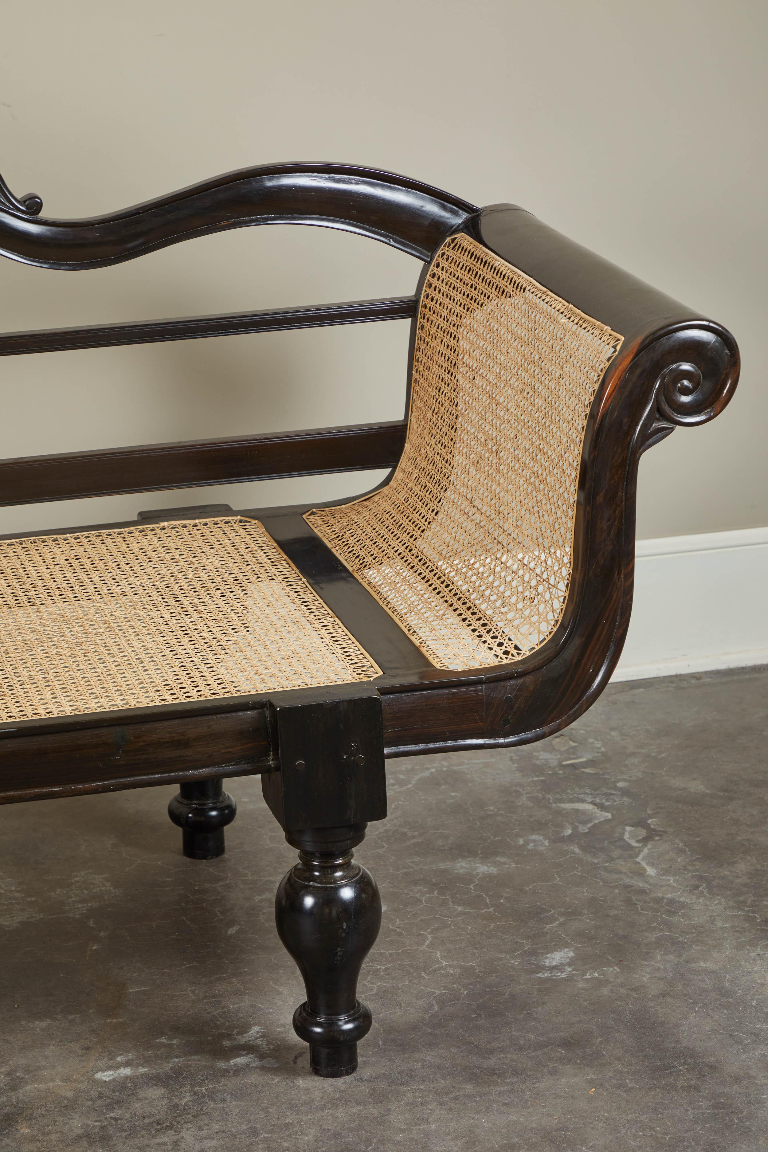 20th Century British Colonial Ebony Bench with Caned Seat and Arms 2