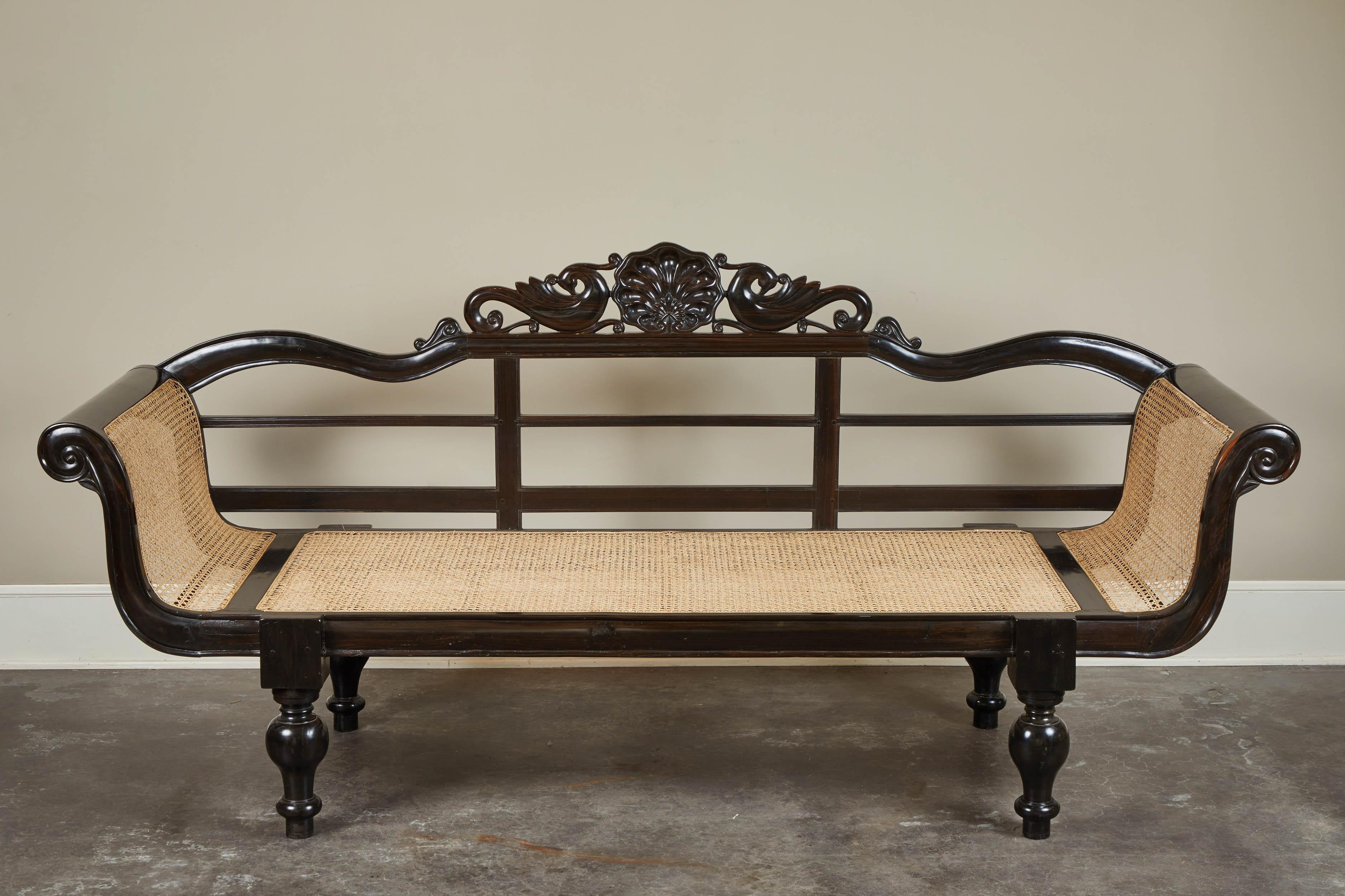Sri Lankan 20th Century British Colonial Ebony Bench with Caned Seat and Arms