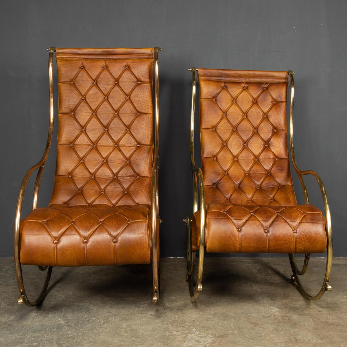 Mid 20th century British made pair of tan leather rocking chairs, howing superb patina and colour, this wonderful pair of chairs were hand upholstered sheepskin leather in Britain by the finest craftsmen in the mid part of the 20th