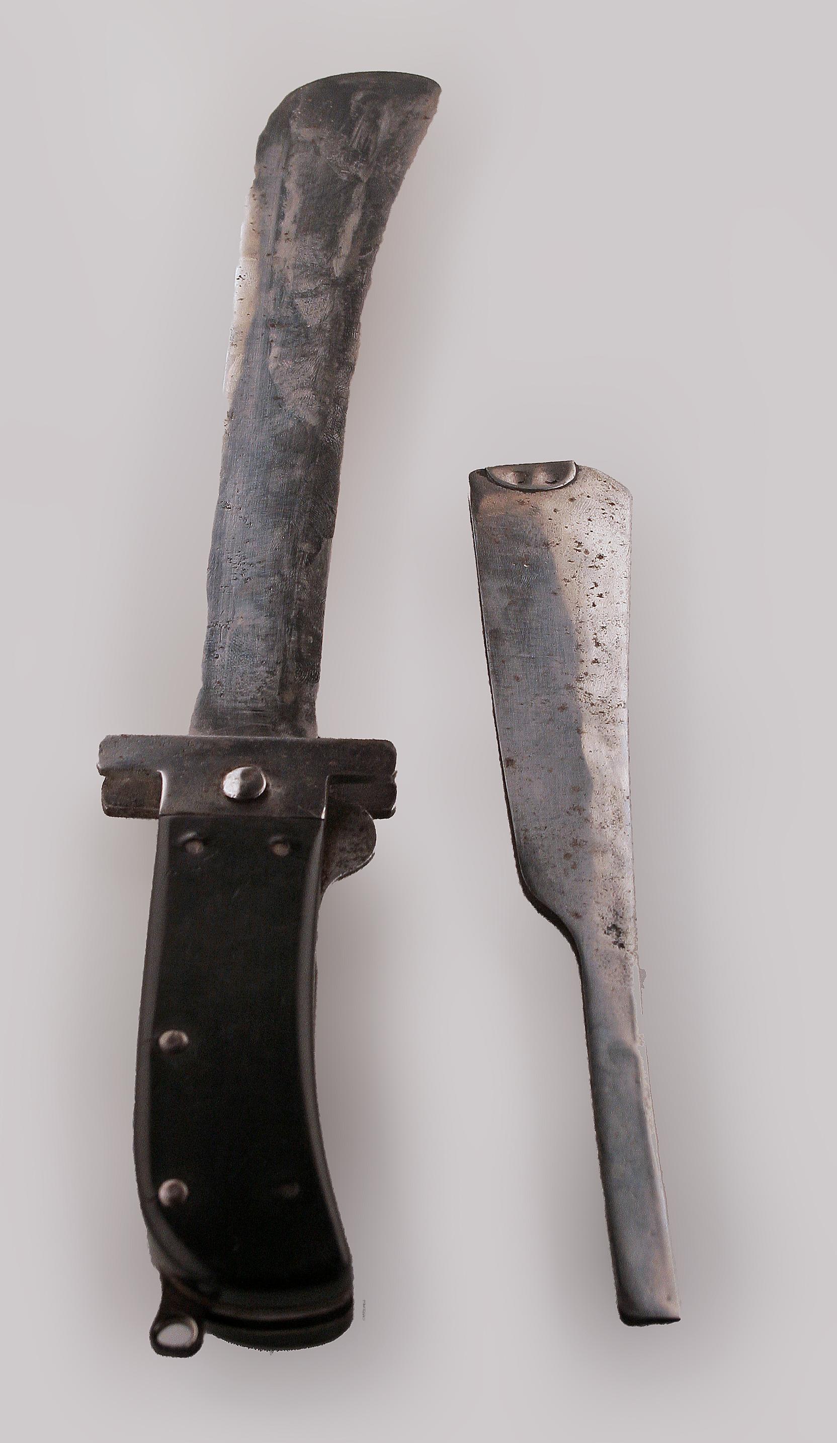 Mid-20th century british military folding steel blade machete/sword by Joseph Westby & Co.

By: Joseph Westby & Co.
Material: steel, metal, iron, synthetic, bakelite
Technique: hammered, plated, molded, polished, forged, cast, metalwork
Dimensions:
