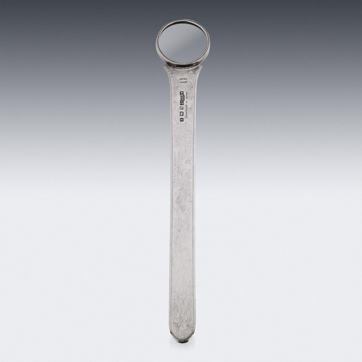 Antique early-20th Century British solid silver magnifying glass & ruler, with engraved silver mounts and a handle terminating with a finger loop. Hallmarked English silver (925 standard), Birmingham, year 1929 (E), Maker A&CoLtd (Asprey & Co Ltd).