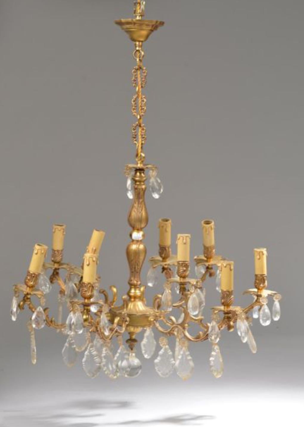 Bronze chandelier with ten lights with crystal decorations.
France, circa 1920
Measures: High: 72 cm - Diameter: 65 cm.