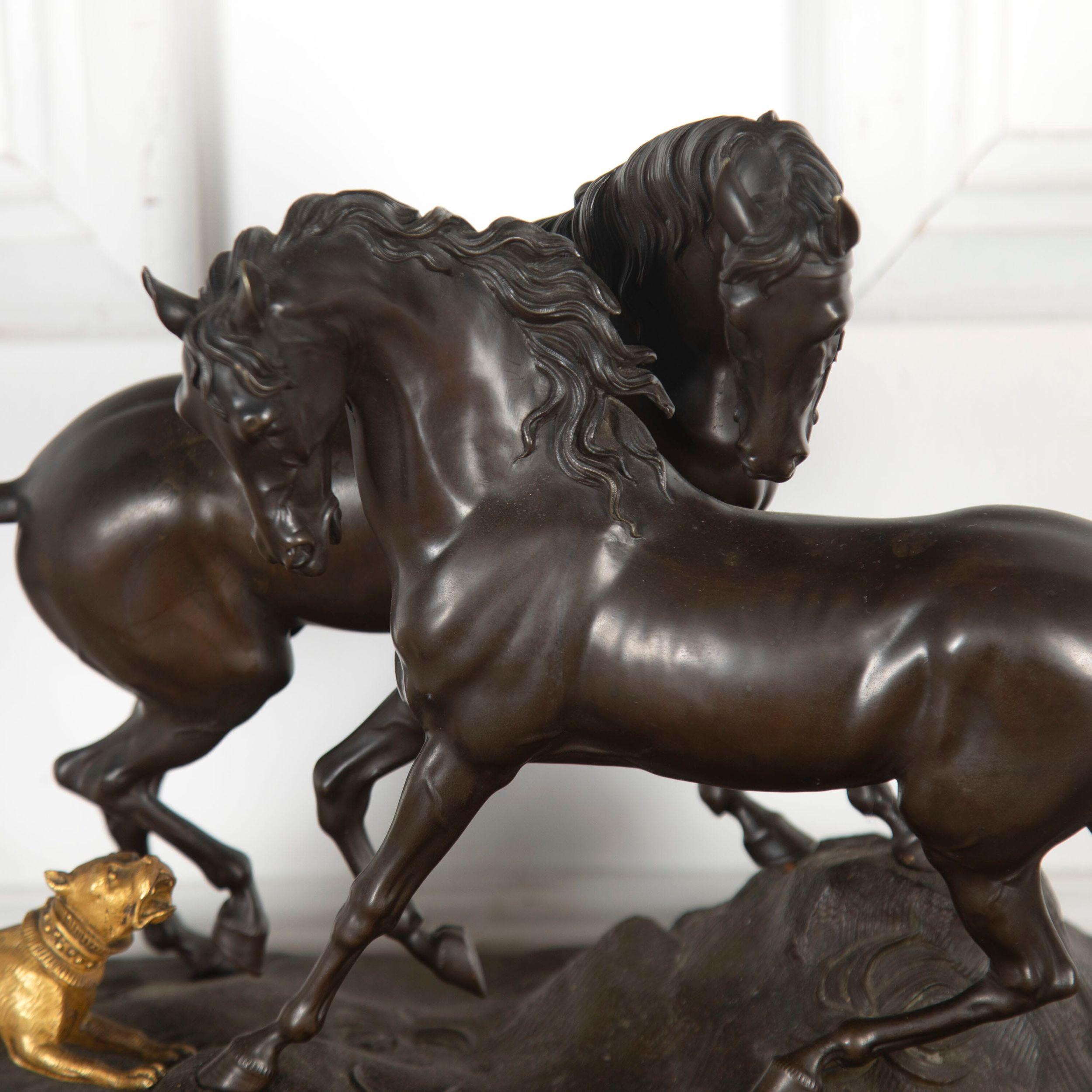Superb 20th century quality bronze sculpture of two horses cautiously defending eachother with a gilt figure of a dog barking at them.

Finely cast after the original by Pierre Jules Mene, (sculptor), 1810 - 1879, entitled 'L'accolade'.

This