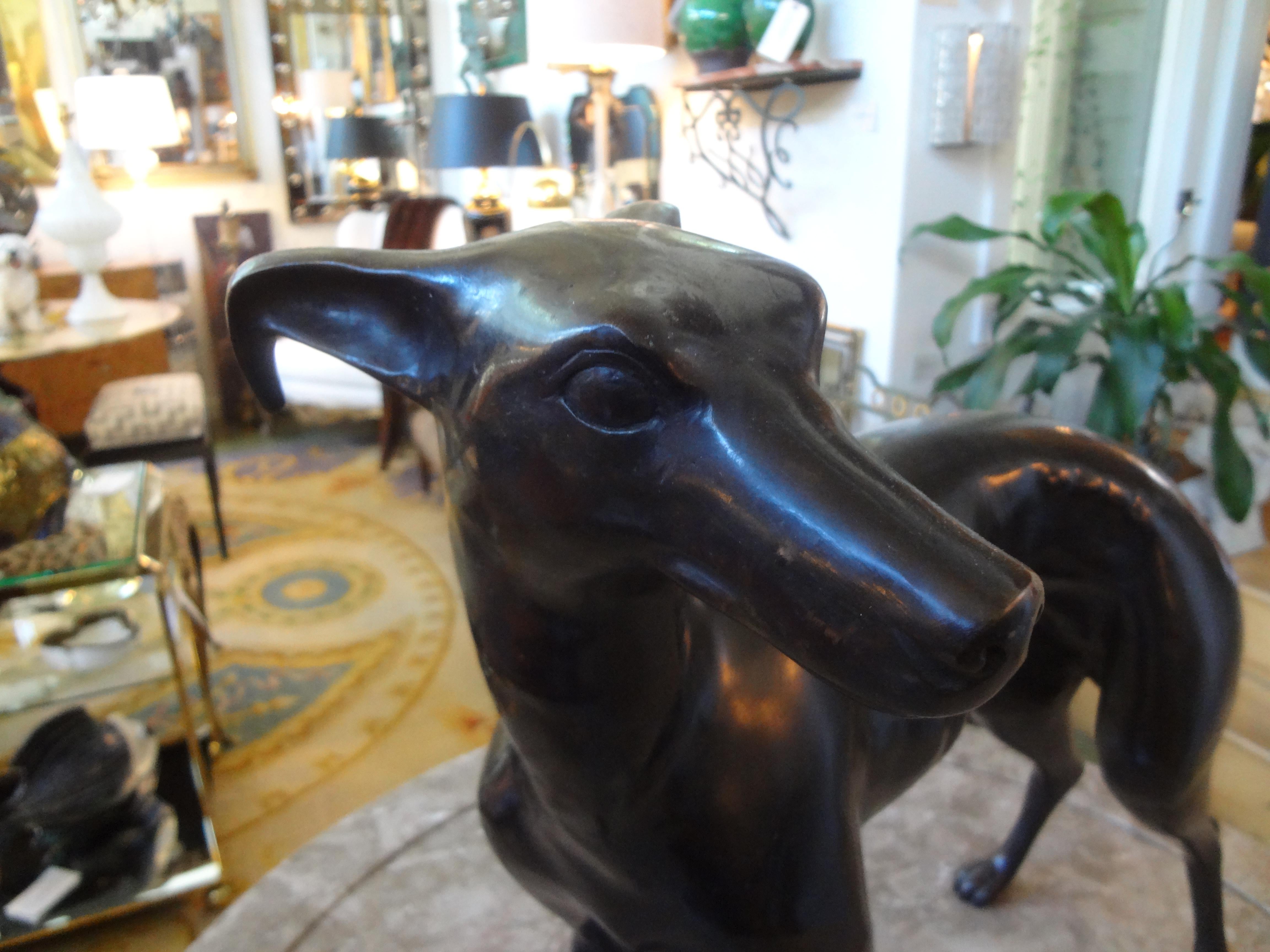 20th century Bronze whippet sculpture.
Beautifully executed Hollywood Regency bronze whippet or greyhound statue or figure from the Mid-20th Century. This life-sized bronze sculpture is extremely realistic.