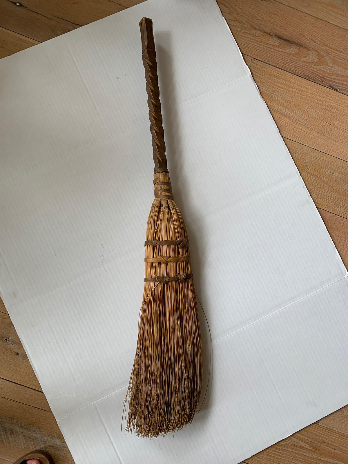 20th century broom with wooden handle.
