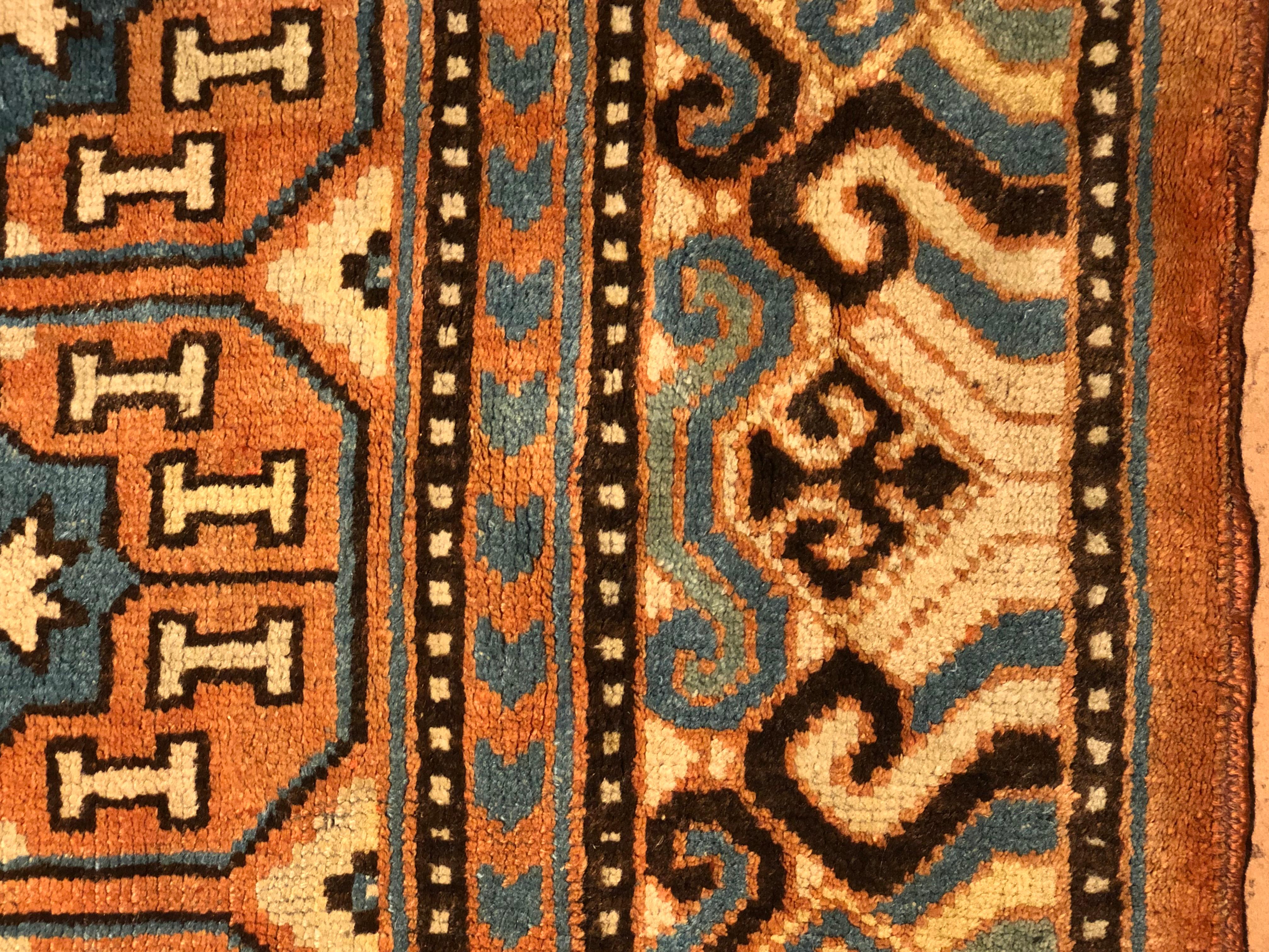 19th Century Brown and Blue Stylized Rosette Gul Chinese Khotan Rug, circa 1870s For Sale 9