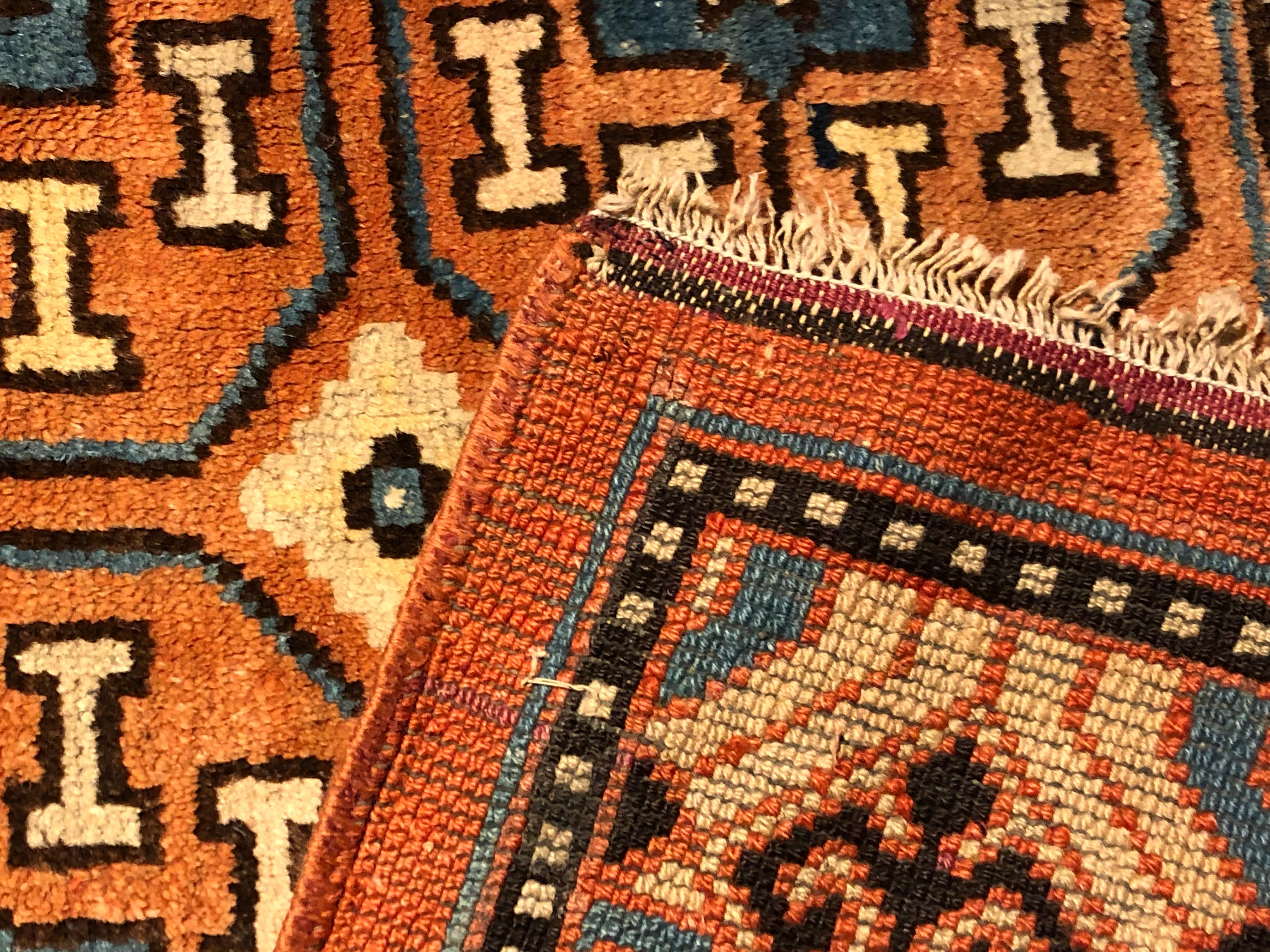 19th Century Brown and Blue Stylized Rosette Gul Chinese Khotan Rug, circa 1870s For Sale 10