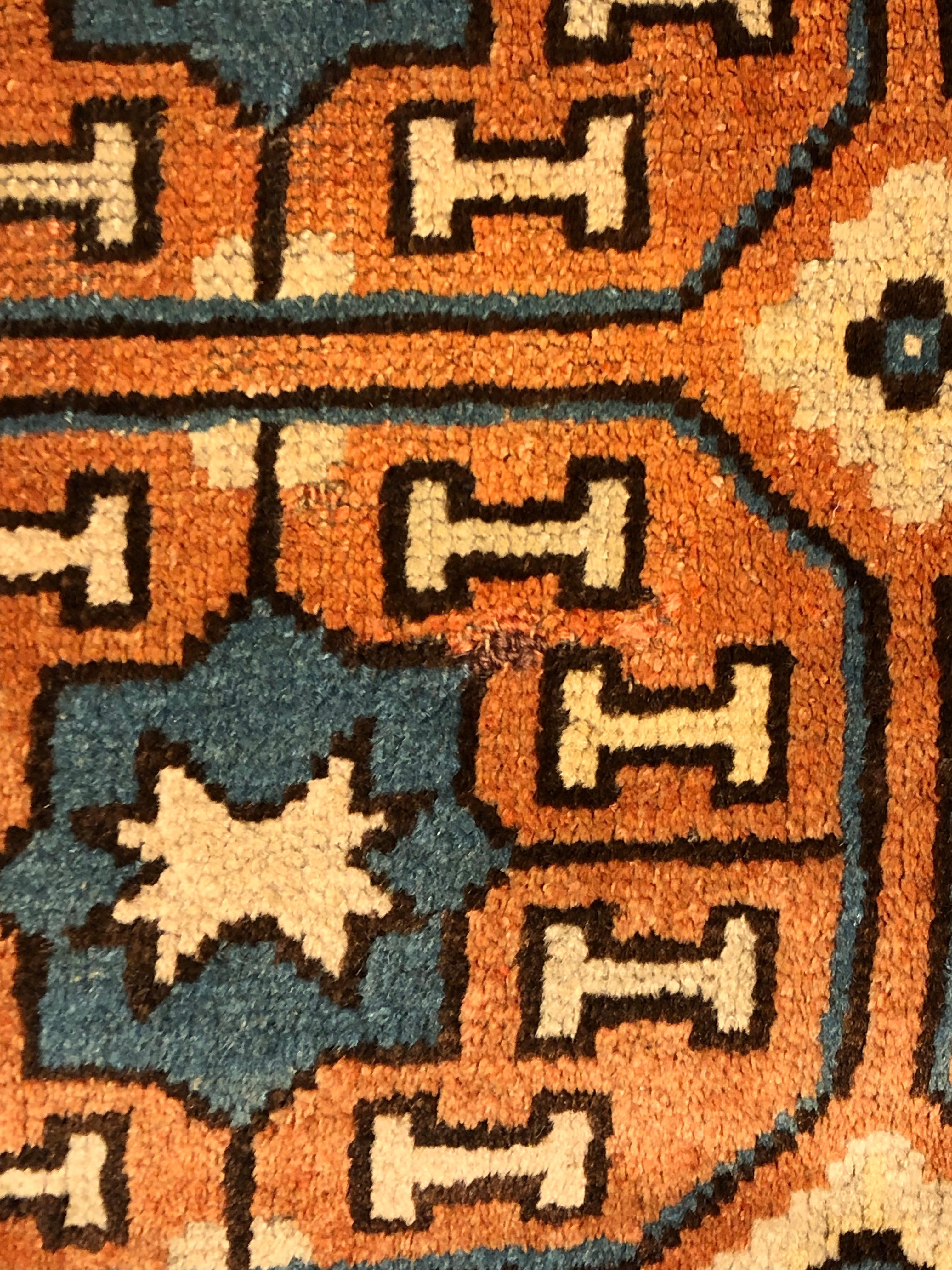 19th Century Brown and Blue Stylized Rosette Gul Chinese Khotan Rug, circa 1870s For Sale 11