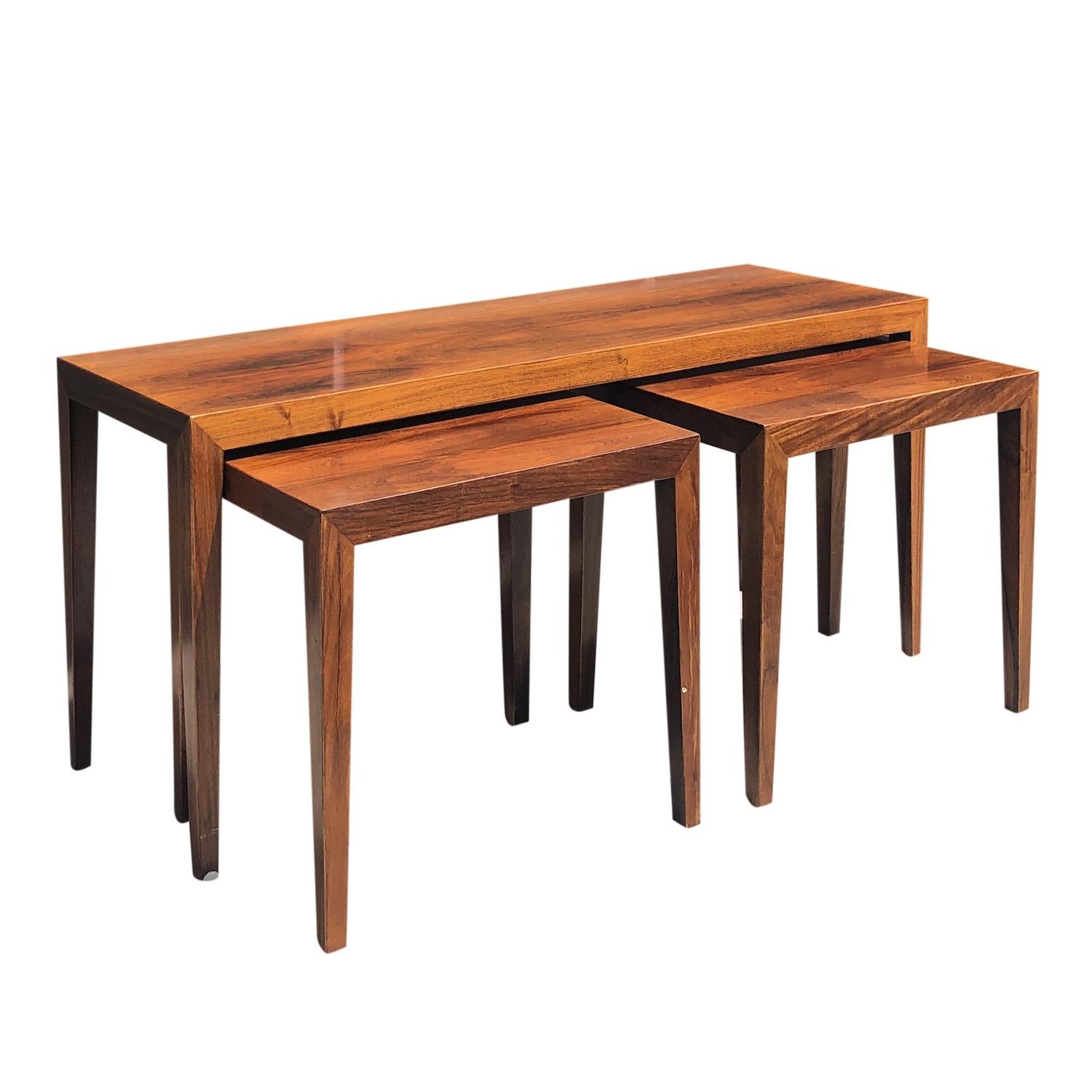 A vintage Mid-Century modern Danish nest of side tables made of hand crafted polished Rosewood designed by Severin Hansen and created by Haslev furniture factory, in good condition. Signed at the bottom. Wear consistent with age and use. Circa 1950