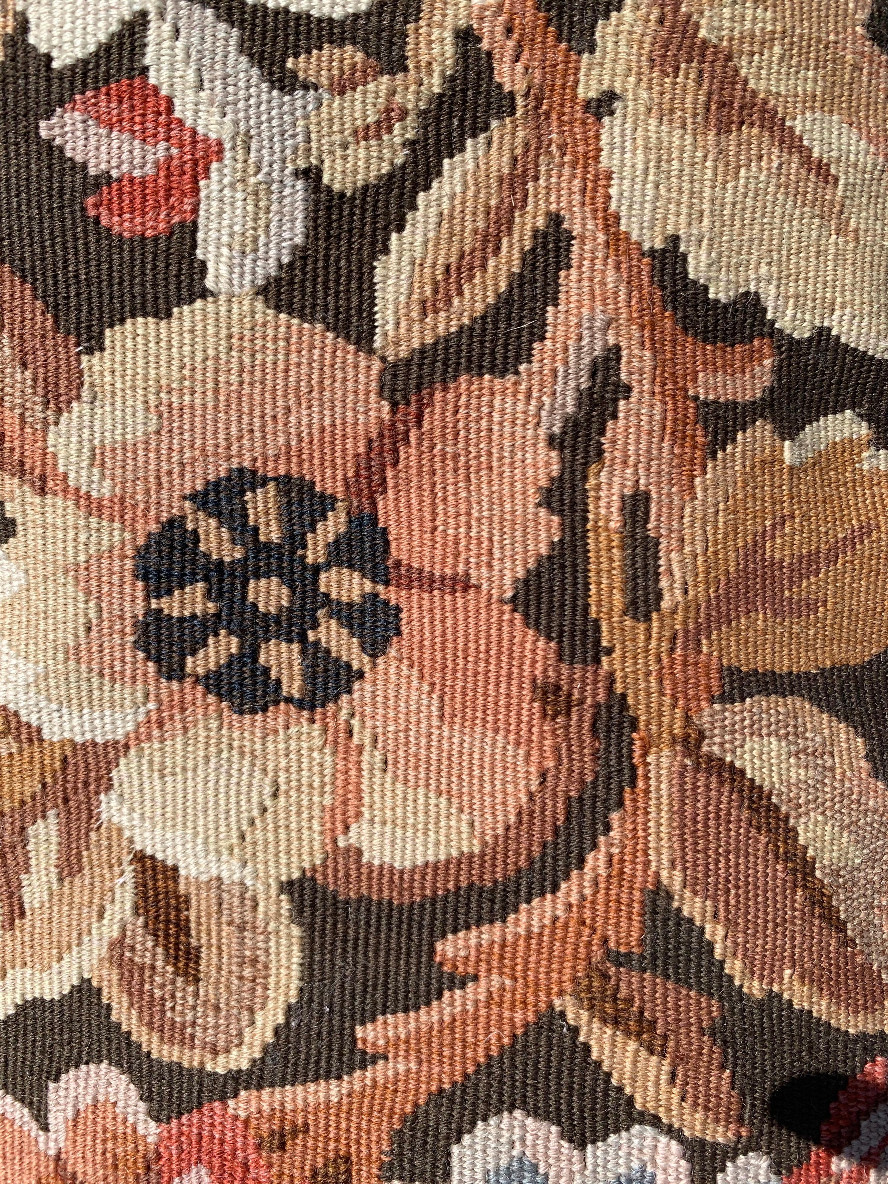 This is a lovely 20th century brown floral French Aubusson style needlepoint lumbar pillowcase. It is new and has never been used. It measures 16.5 x 21 inches.