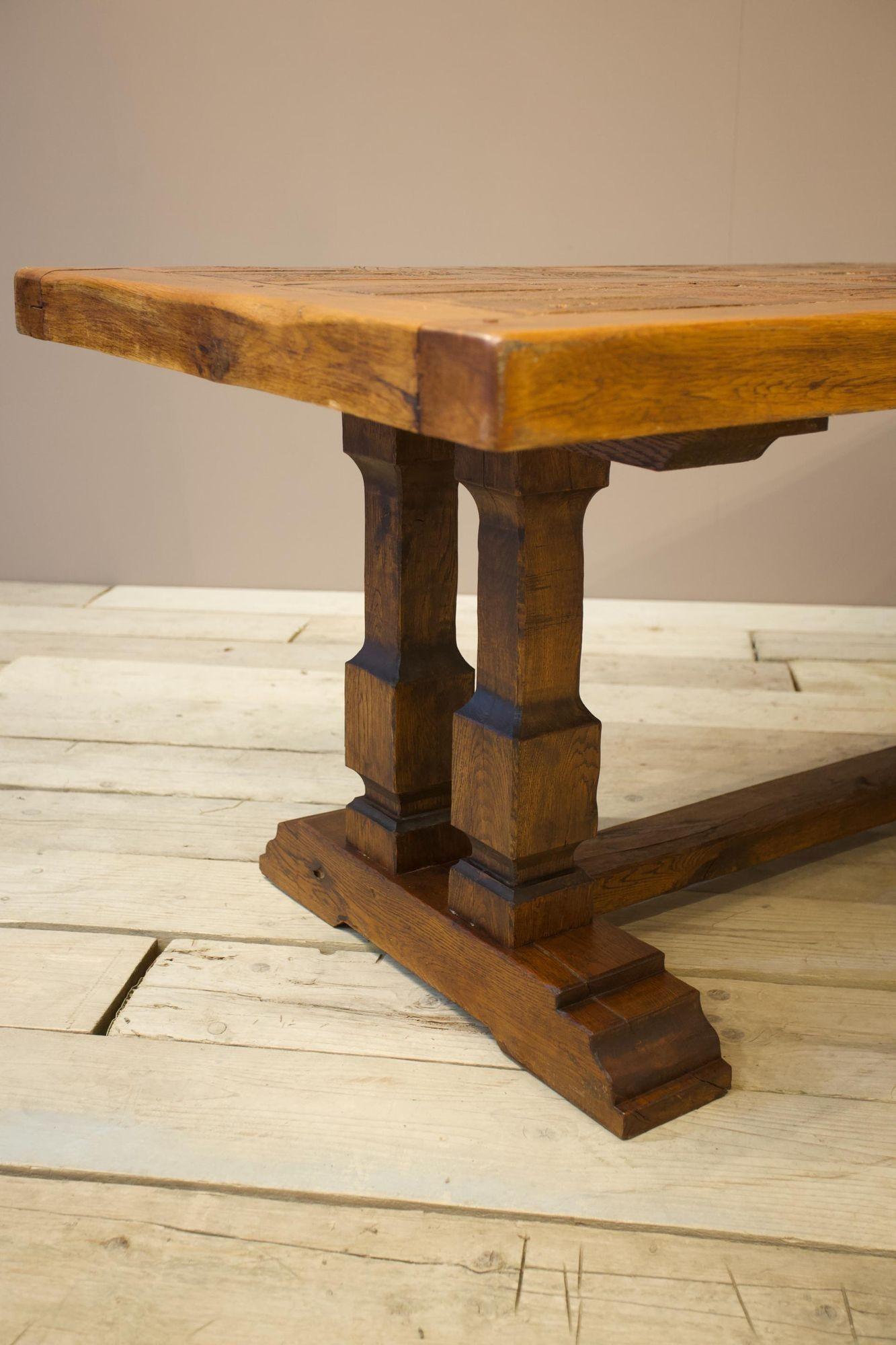 This is a very unusual and interesting brutalist movement dining table. The body is made of solid oak and is inset with had made terracotta bricks that each have a leaf or paw imprint on them. Safe to say this is a very heavy dining table. Great