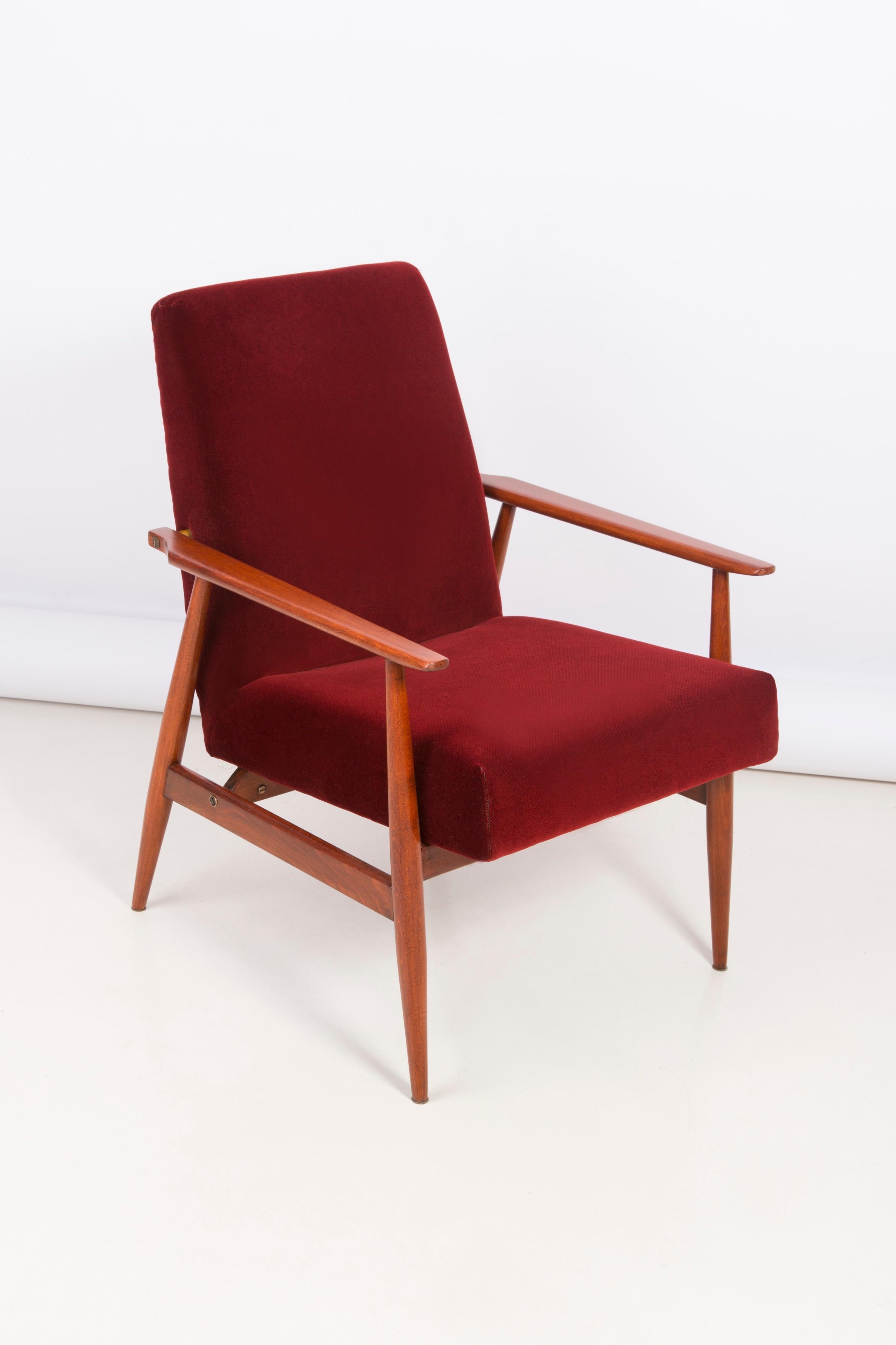 A beautiful, restored armchair designed by Henryk Lis. Furniture after full carpentry and upholstery renovation. The fabric, which is covered with a backrest and a seat, is a high-quality velour upholstery. The armchair will be perfect in Minimalist