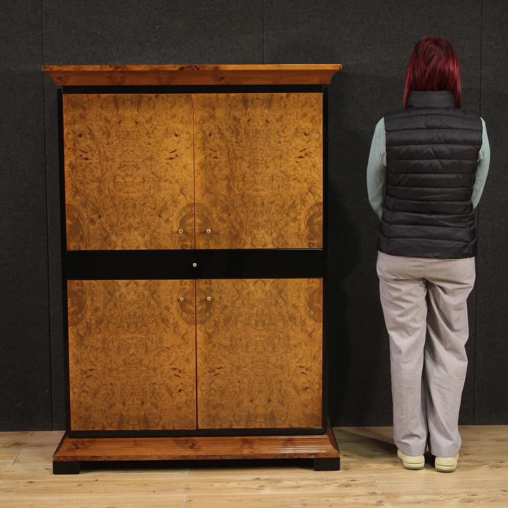 Italian sideboard from the late 20th century. Lacquered wood and burl cabinet of beautiful lines and pleasant furnishings. Sideboard with four doors and a central drawer of excellent capacity. Ideal furniture to be used as a television stand with