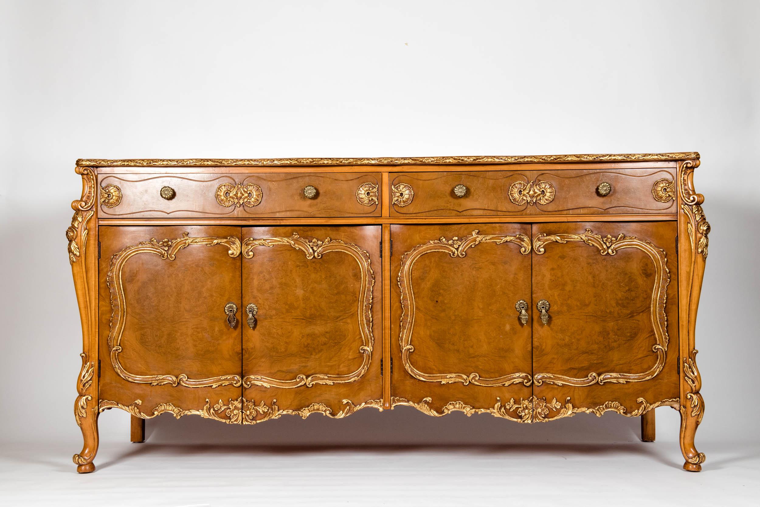 20th century burl wood side board with applied gold design details. The side board is in excellent vintage condition. Maker's mark & numbered. Minor wear consistent with age / use. The piece measure about 68 inches length x 22 inches wide x 35