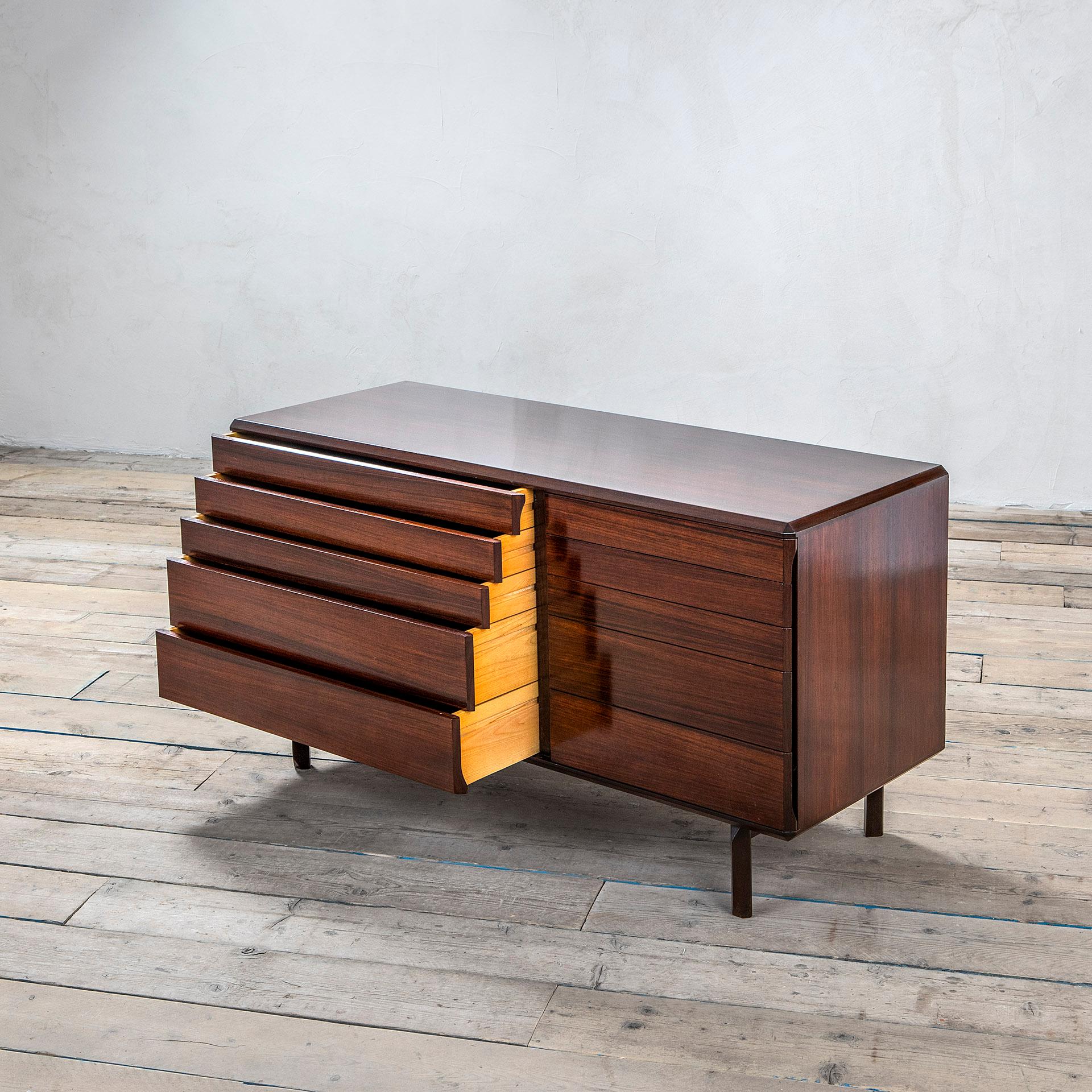 Cabinet designed in 1950s in the style of Ico Parisi. The cabinet is totally in wood and has 10 drawers. The rectangular shape of the furniture is made more elegant thanks to a cut all along the corners that should be at 90 degrees, but are actually