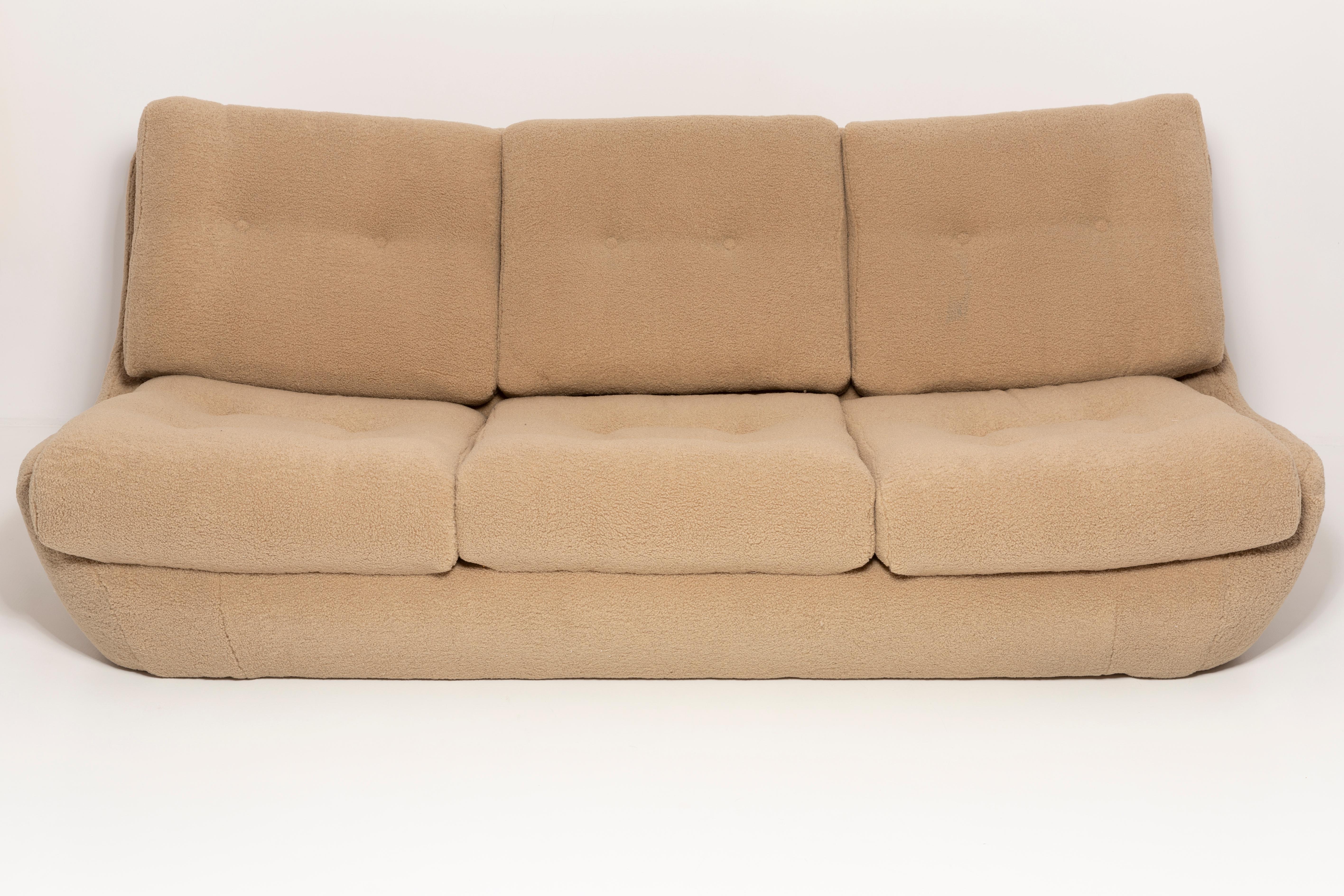 Atlantis sofa from the 1960s, produced in Czech Republic - at the moment they are unique. Due to their dimensions, they perfectly blend in even in small apartments providing comfort and beautiful decoration. Covered with high-quality camel boucle