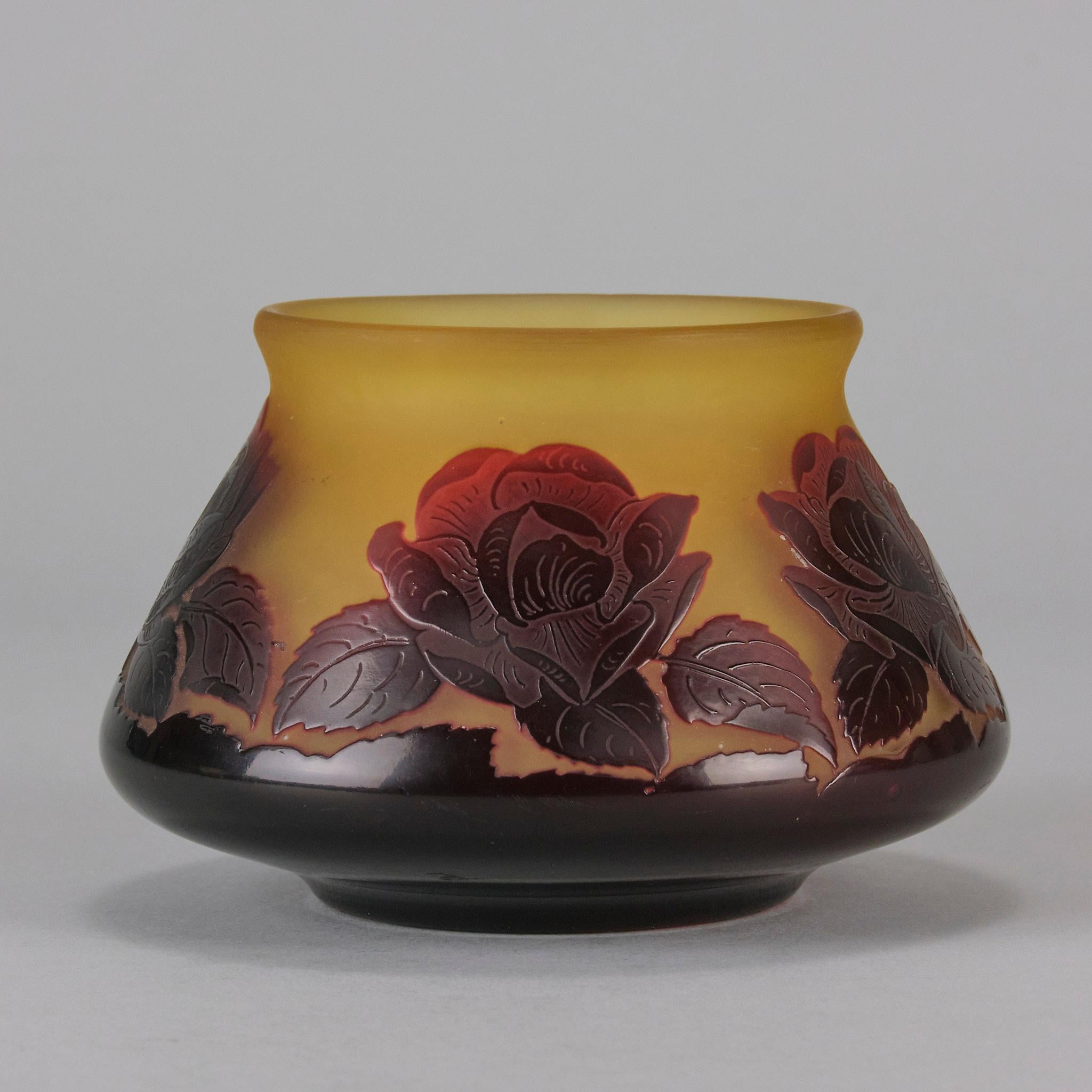 A beautiful early 20th Century cameo glass vase acid cut and etched with a deep red floral decoration against a yellow background. Exhibiting very fine hand finised surface detail and vibrant colour, signed P.Nicolas in cameo

ADDITIONAL