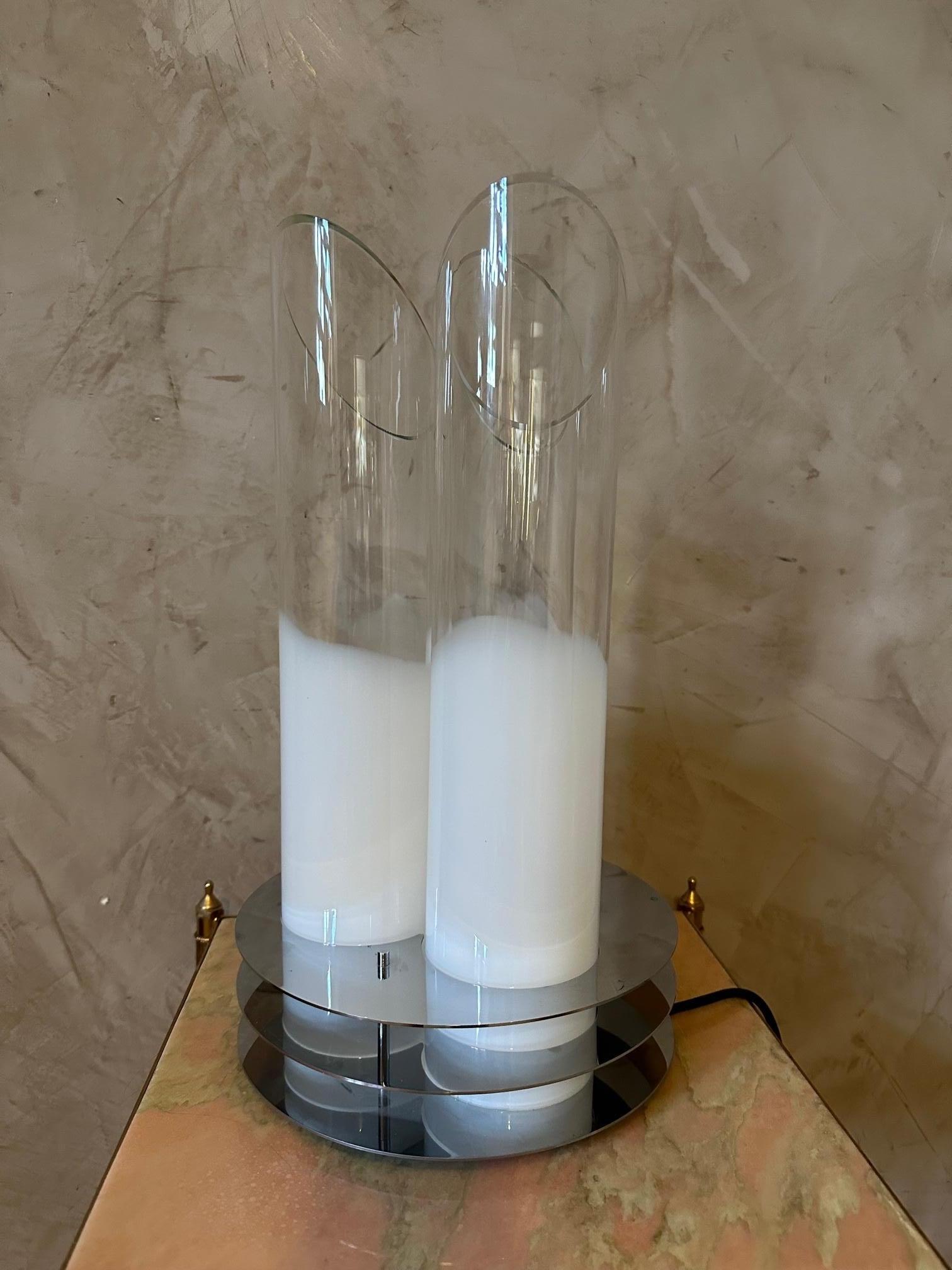 Very beautiful lamp by the famous designer Carlo Nason from the 70s in Murano glass. Three semi-transparent and opaque tubular glasses with chromed metal structure.
Electrical outlet with dimmer.
Superb quality and rare model. The glasses are a bit