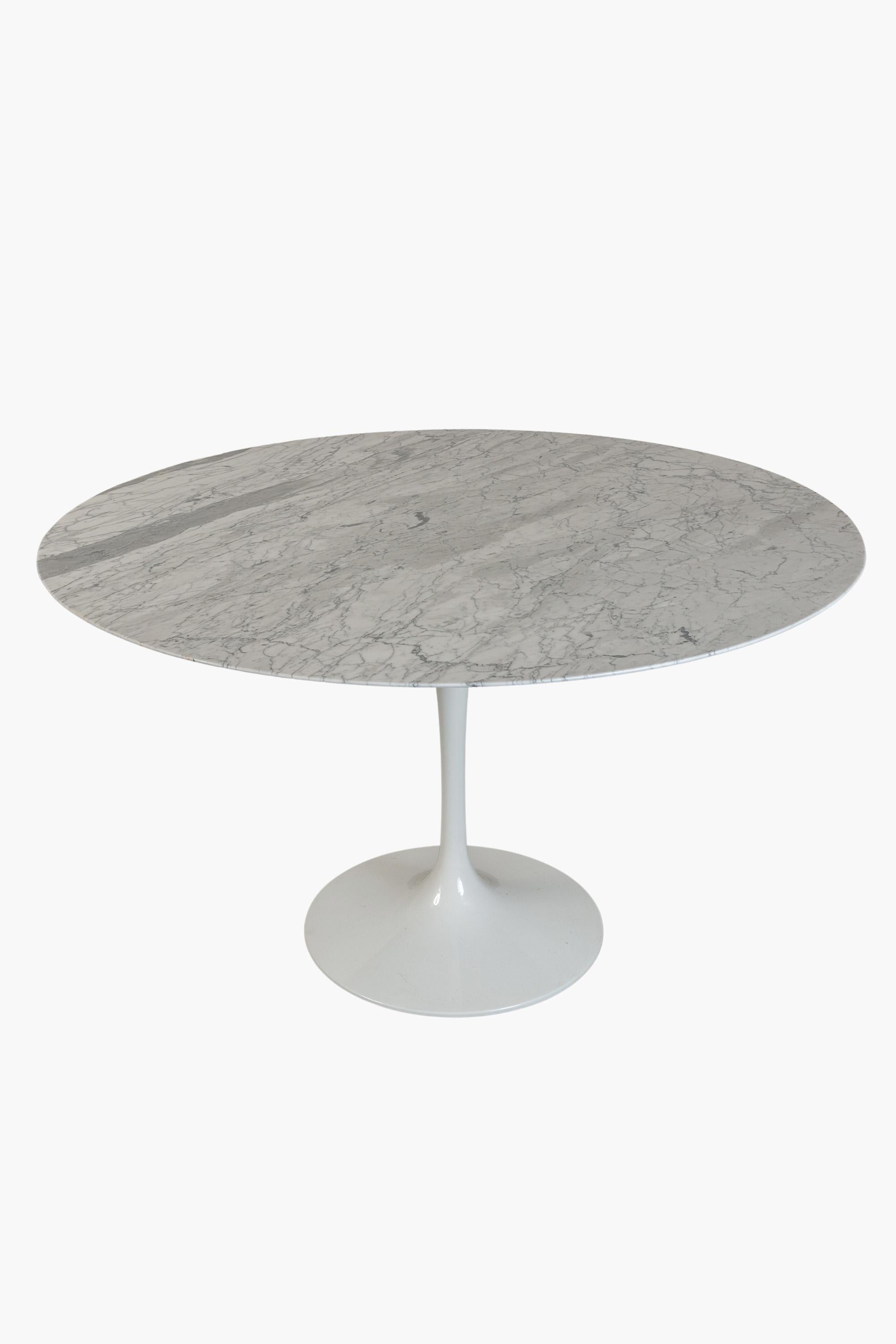 A late 20th Century edition of Eero Saarinen's Tulip Table made with a Carrara marble top.

Considered one of the great icons of design, Saarinen's Tulip Dining Table is characterised by its instantly recognisable single stem and marble