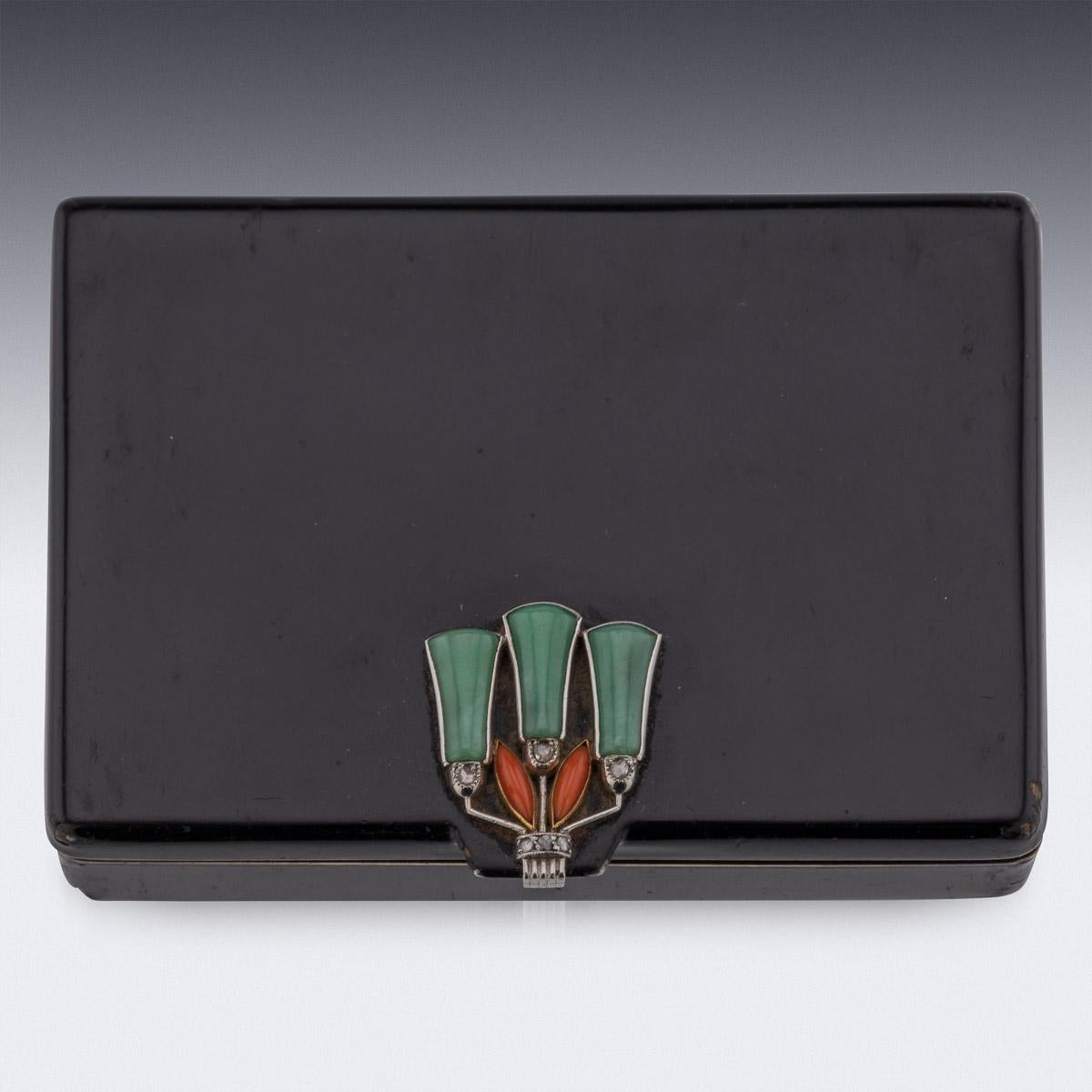 20th Century French Cartier Art Deco gold vanity case, of rectangular form with rounded corners, the lid set with a flower shaped thumb-piece, with jade and corals, mounted on platinum set with 6 old cut diamonds, the whole box is applied with black