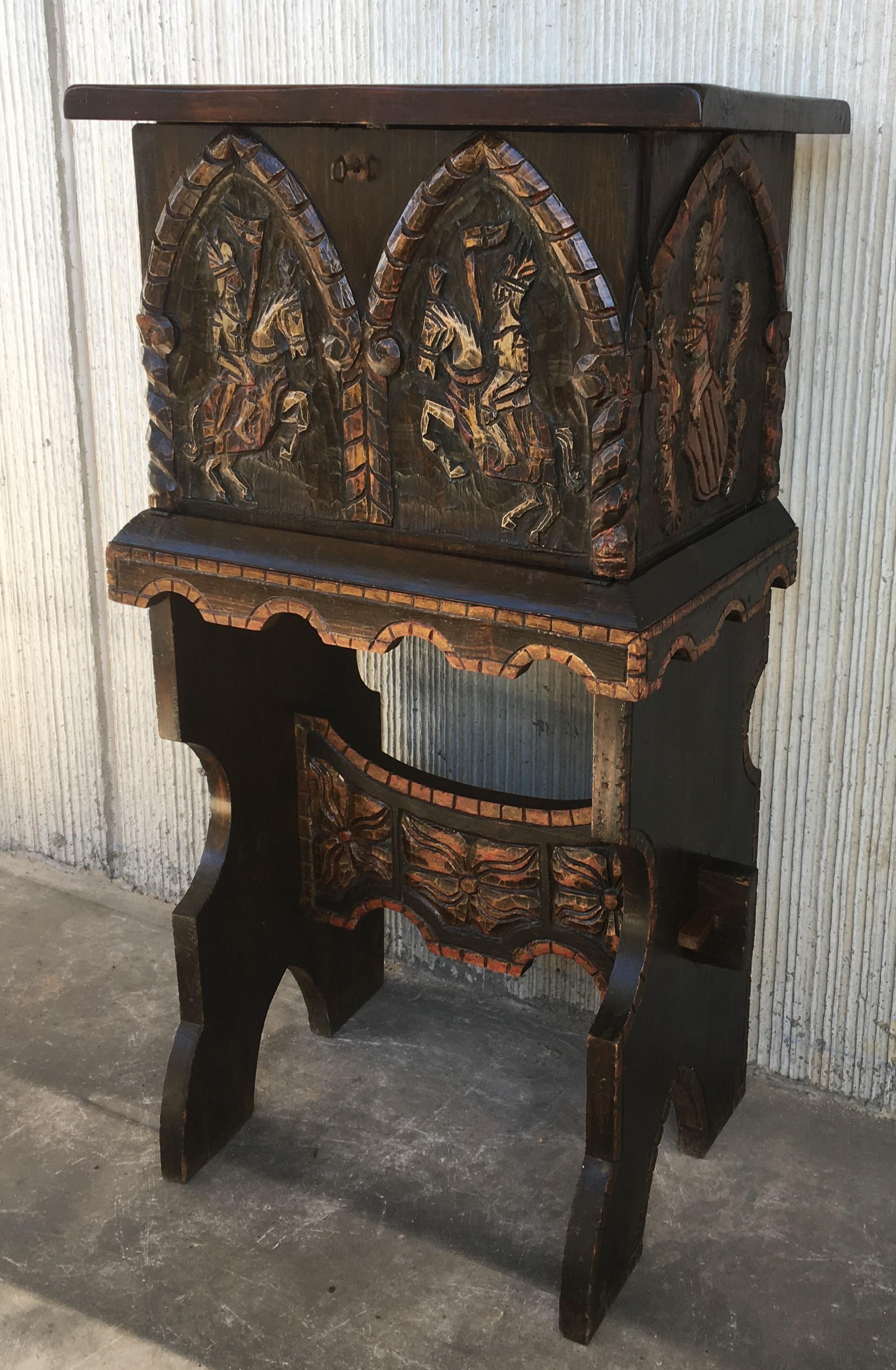 20th century cabinet bar on stand, Varqueno, Bargueño, buffet, Spain

Impressive carved and polichromed cabinet bar on stand. 
Beautiful reliefs with heraldics motifs and horse rider cavalry depicting.
It proceeds of a Monte Picayo Casino in