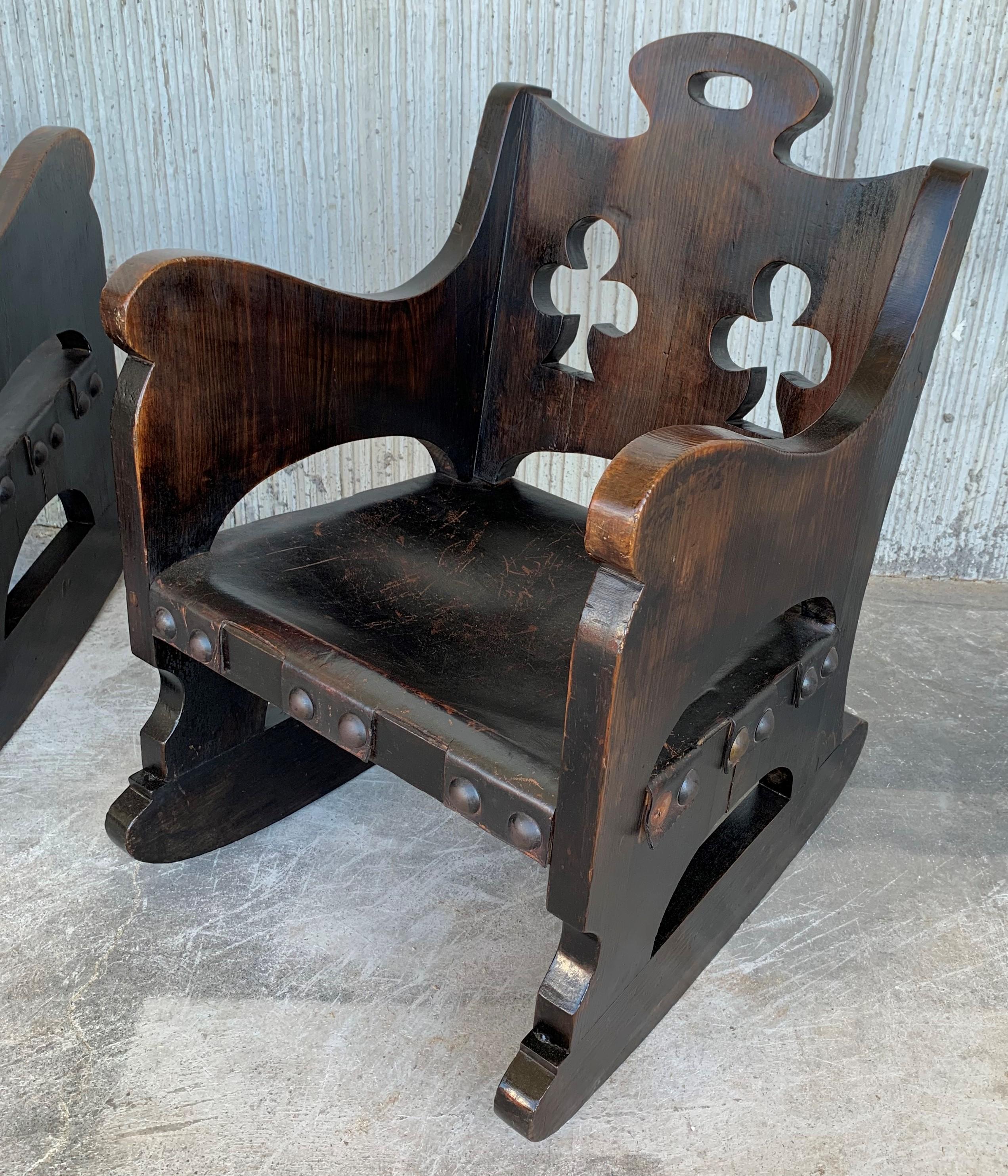 Hand-Carved 20th Century Carved Walnut Spanish Rocking Chairs Featuring Ace of Clubs For Sale